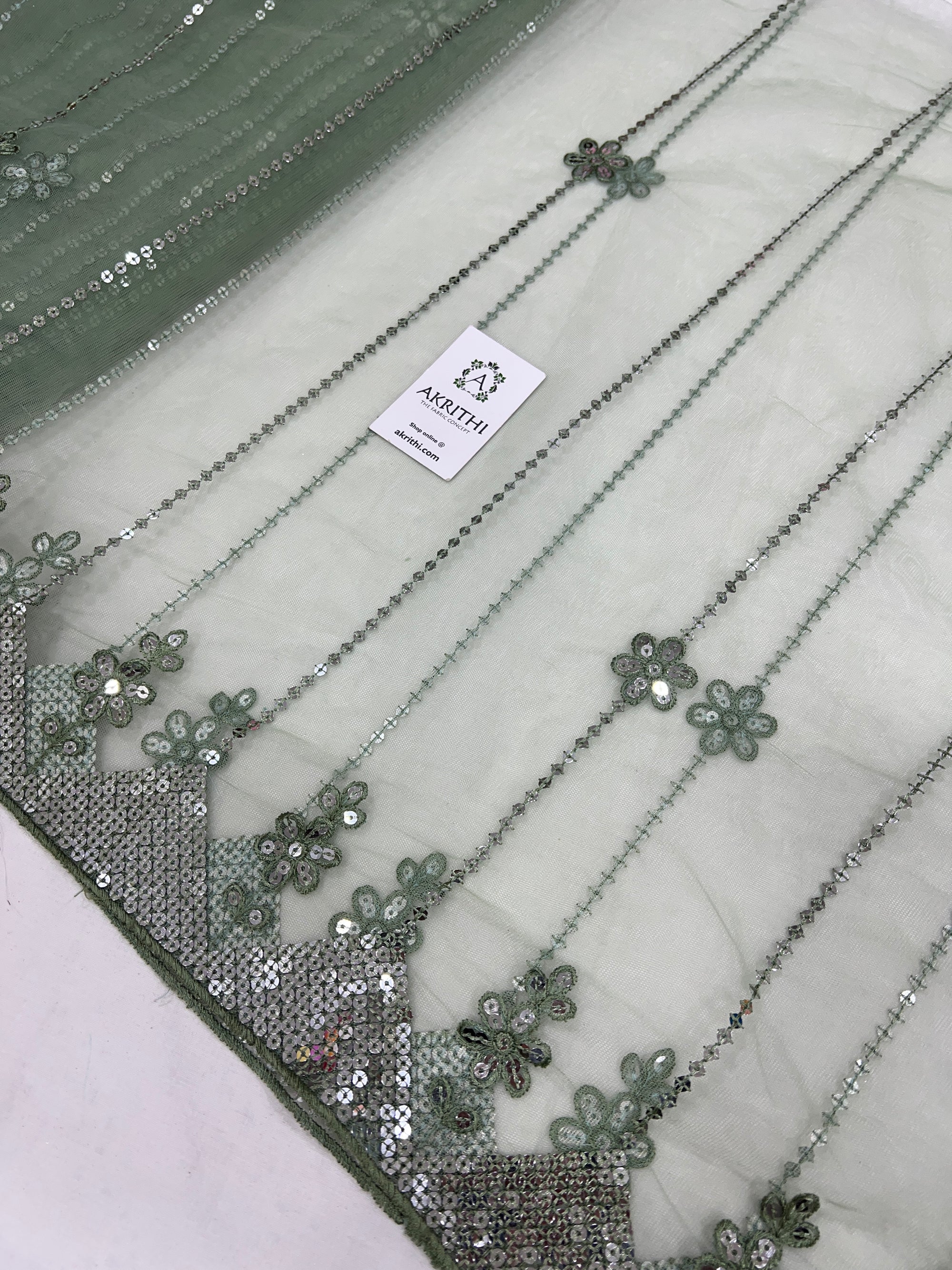 Embroidered net fabric