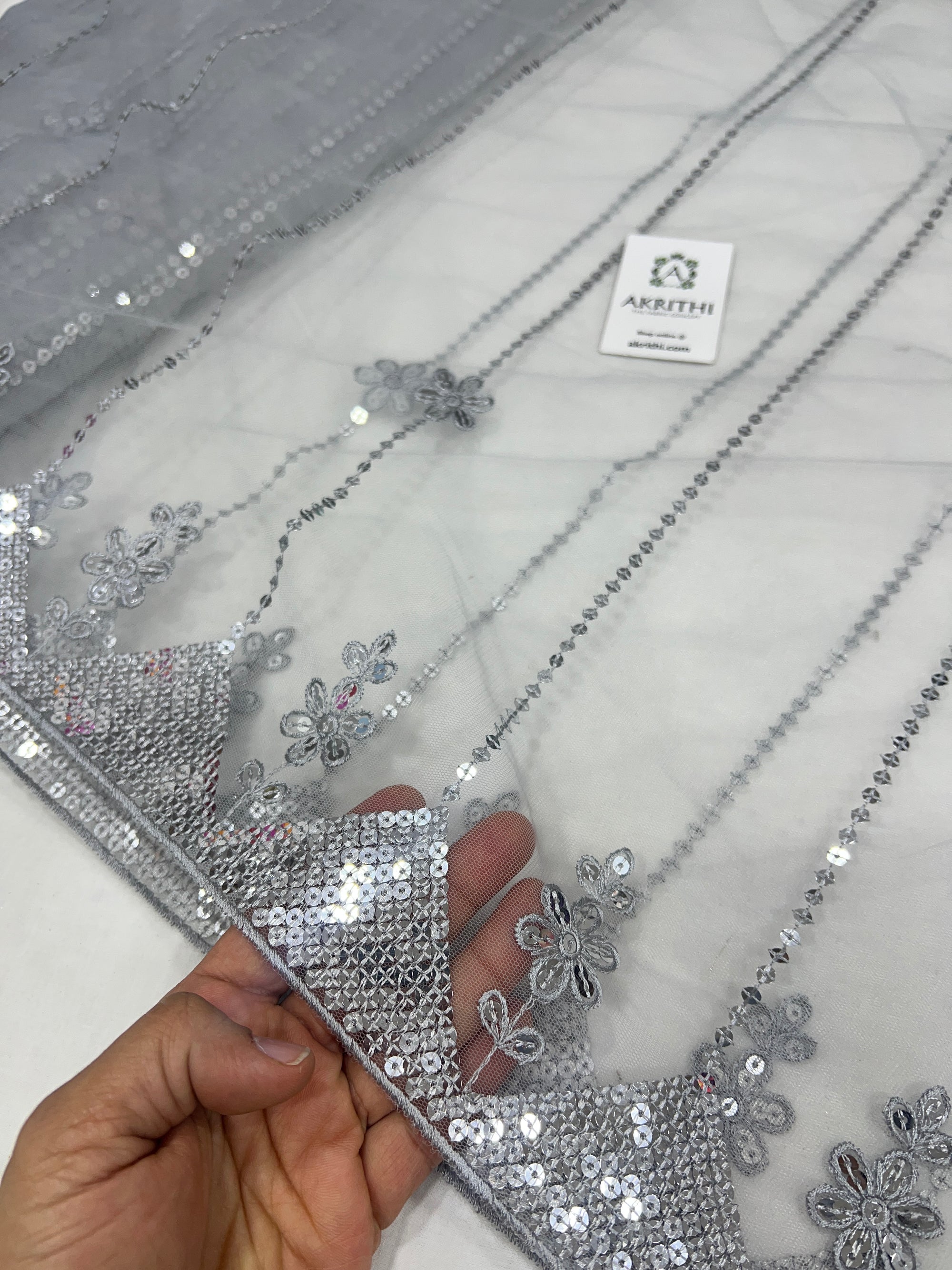 Embroidered net fabric