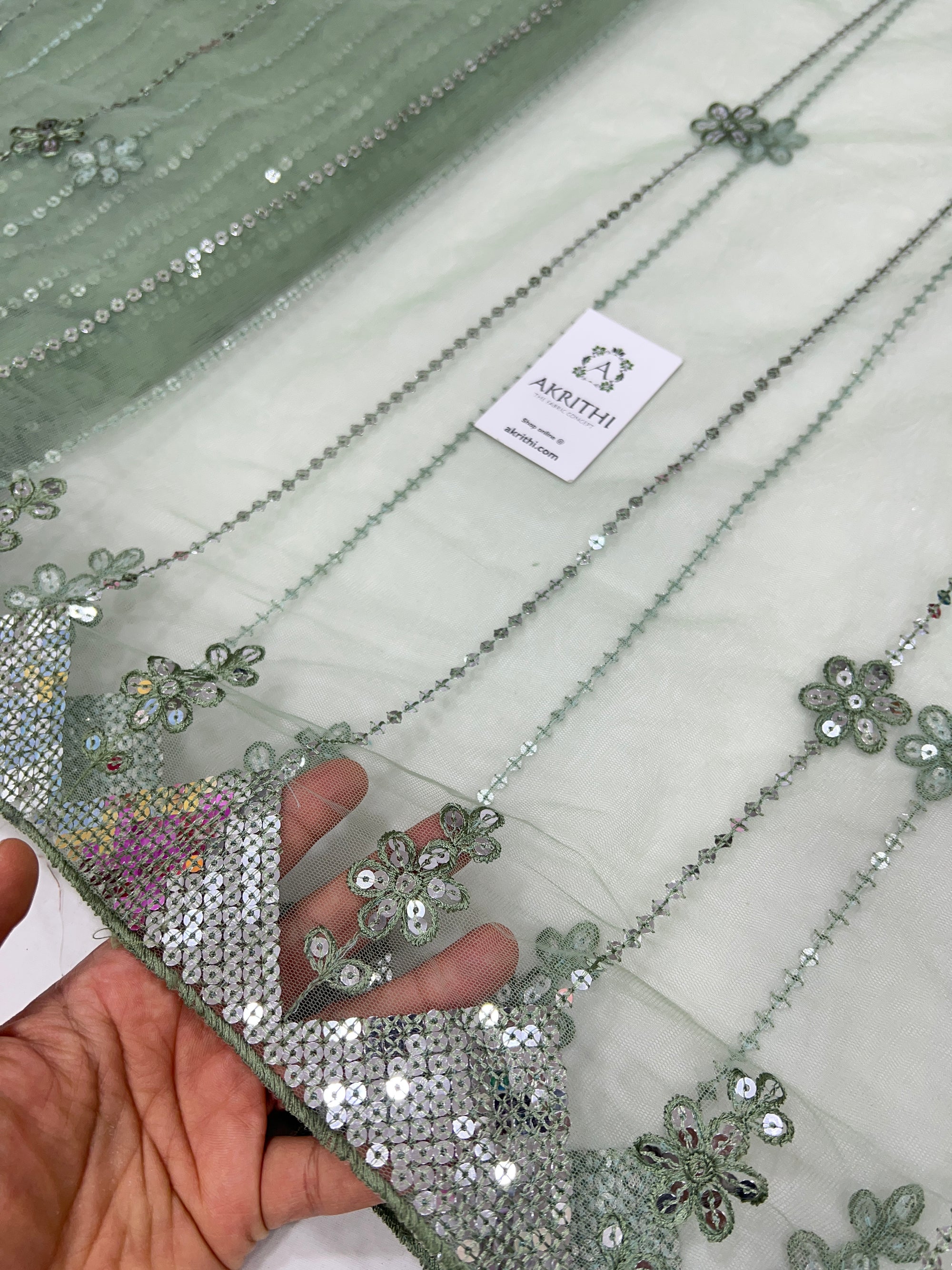 Embroidered net fabric