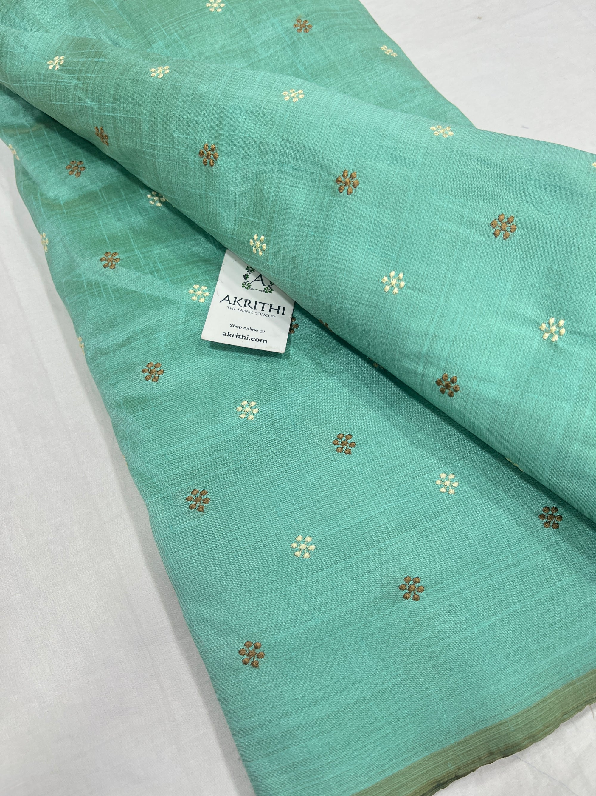 Embroidered raw silk fabric