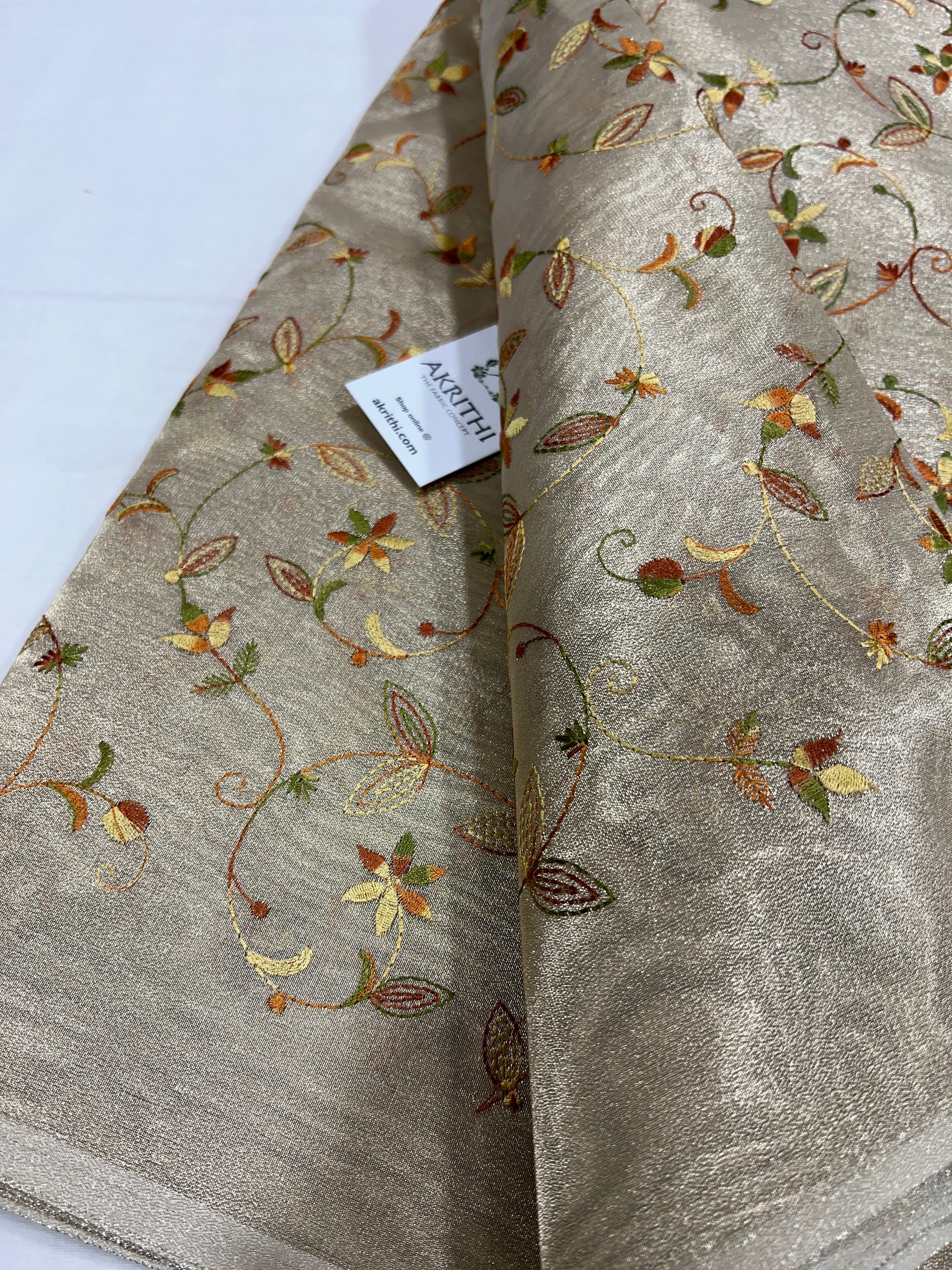 Embroidery on tissue fabric