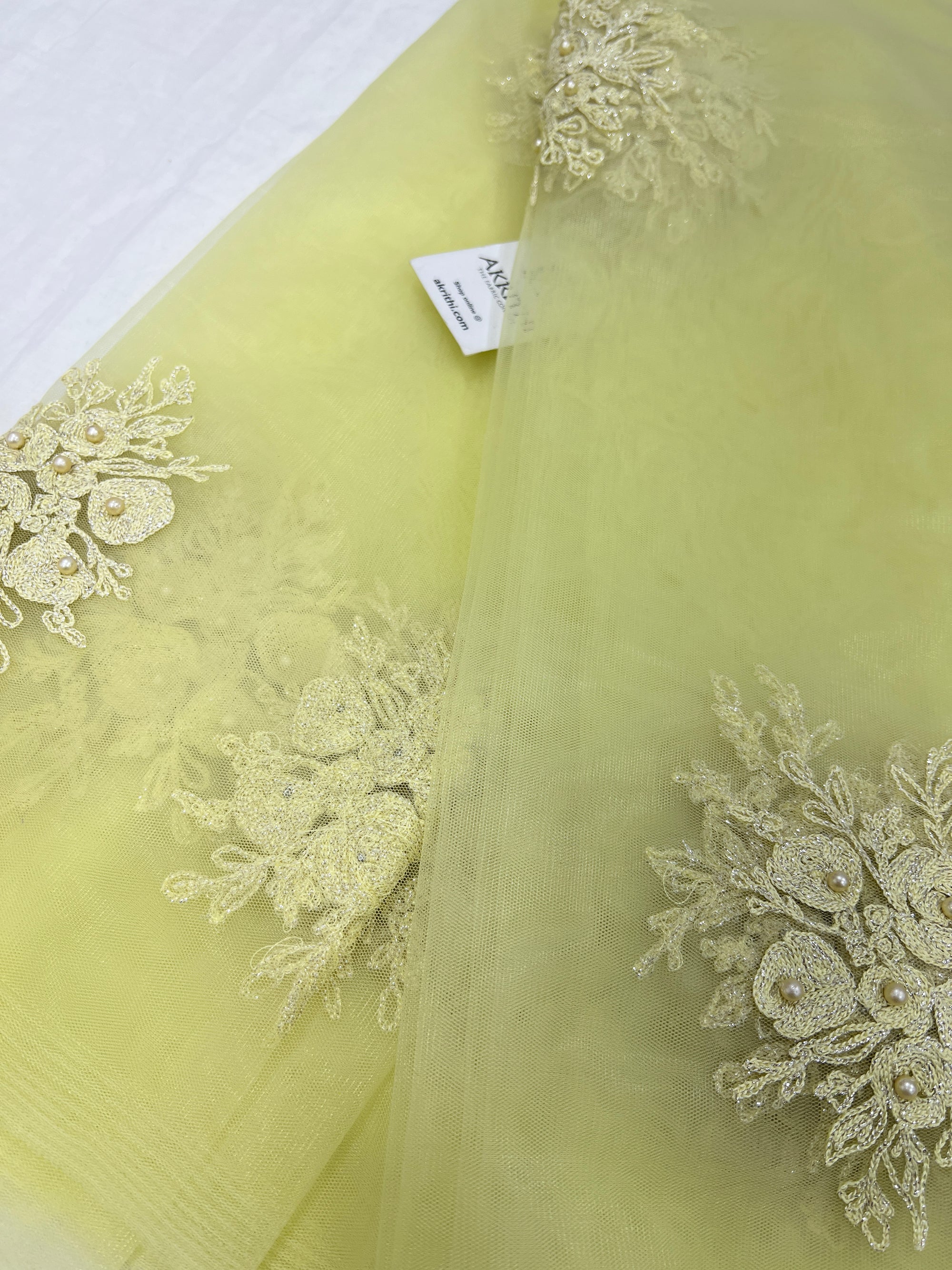 Embroidered net fabric