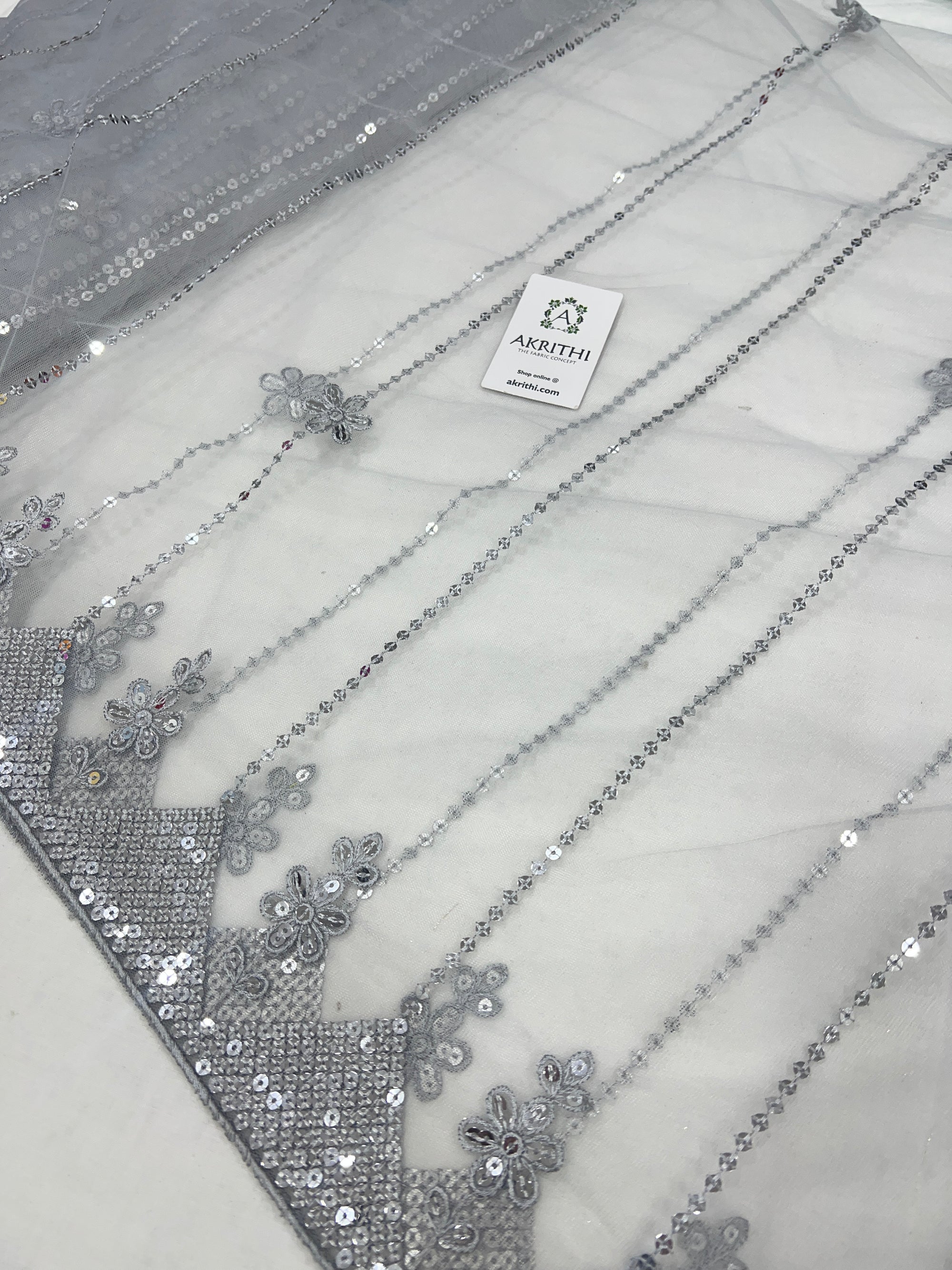 Embroidered net fabric