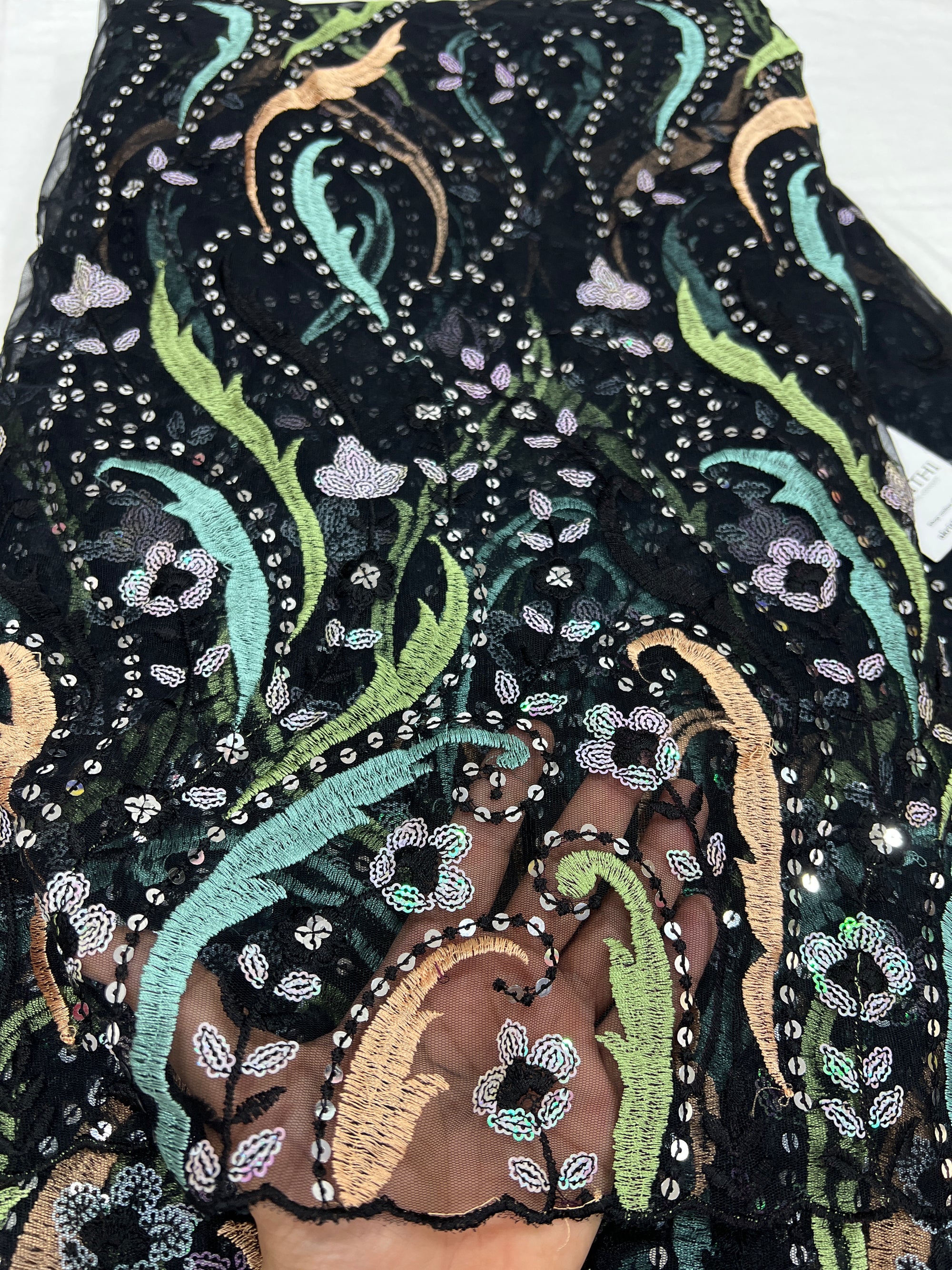 Embroidered net fabric