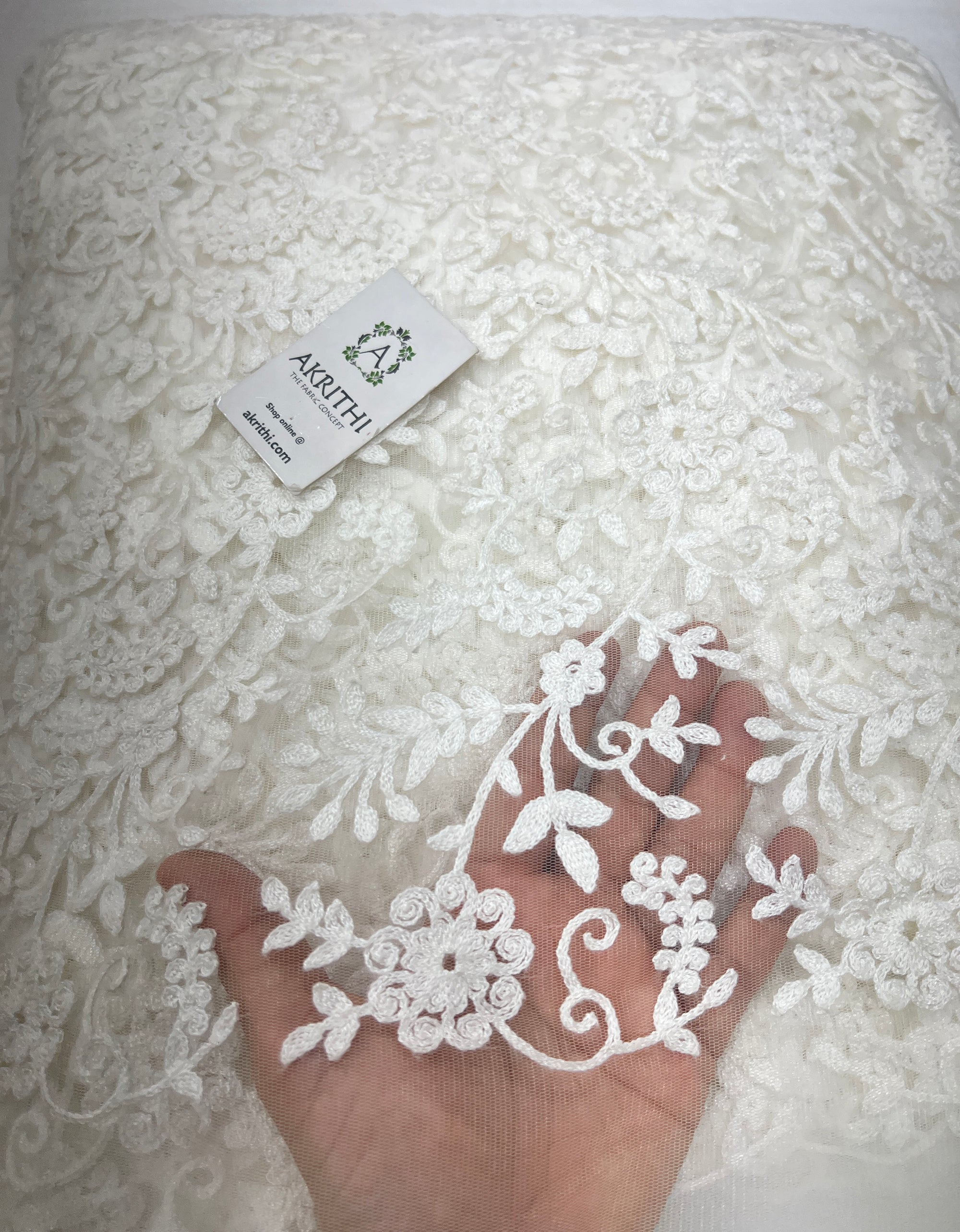 Embroidered net fabric