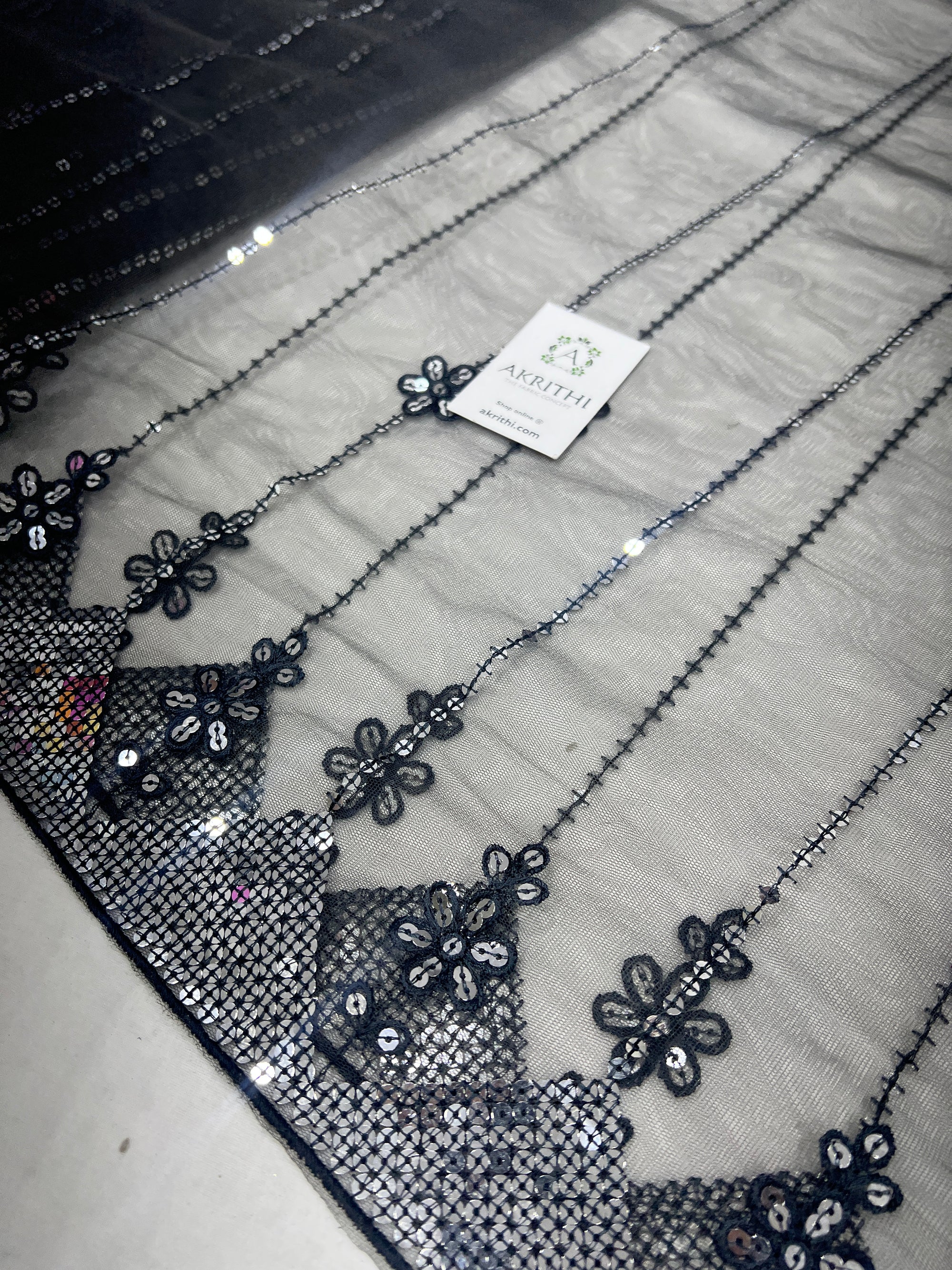 Embroidered net fabric