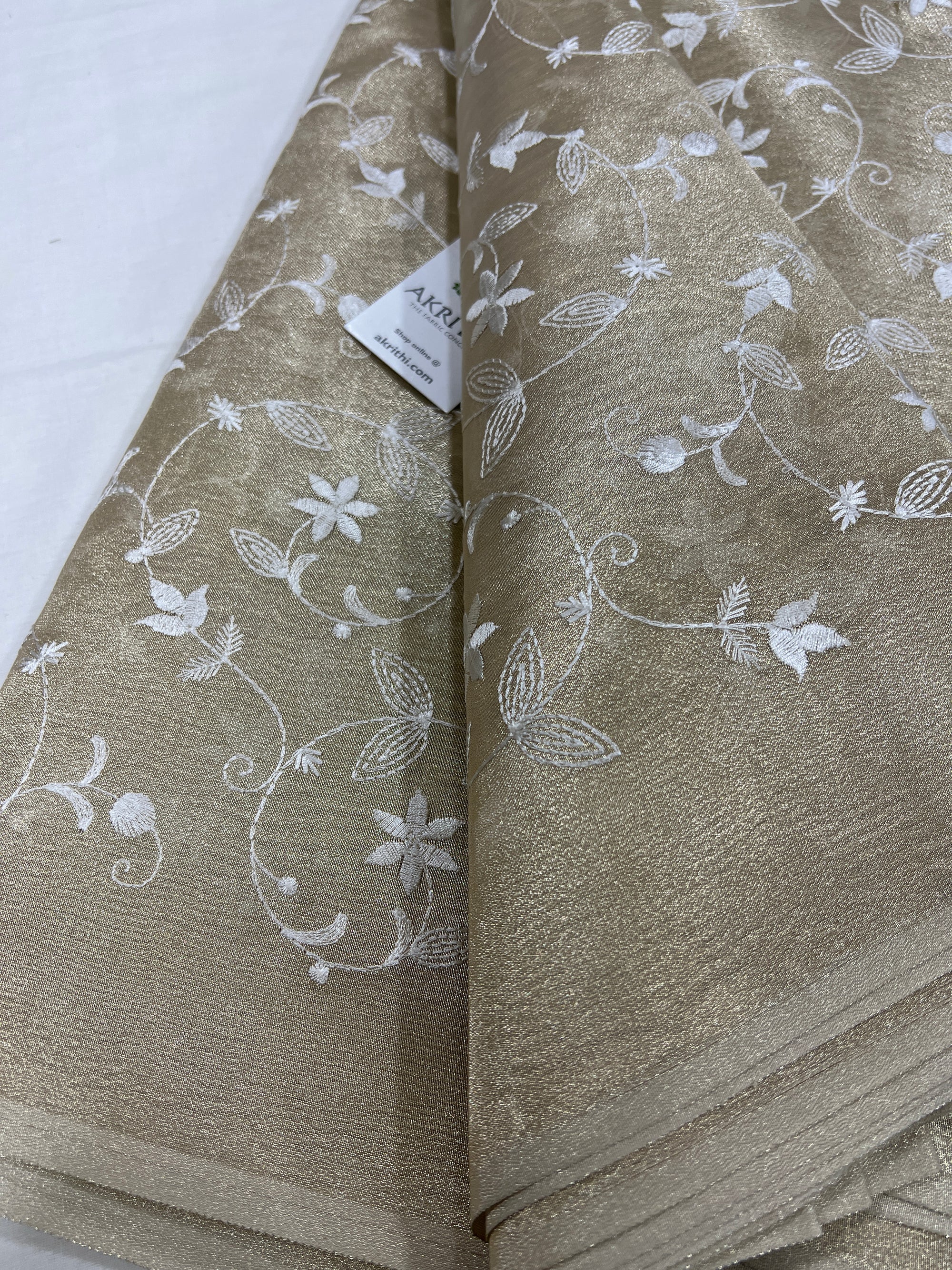 Embroidery on tissue fabric