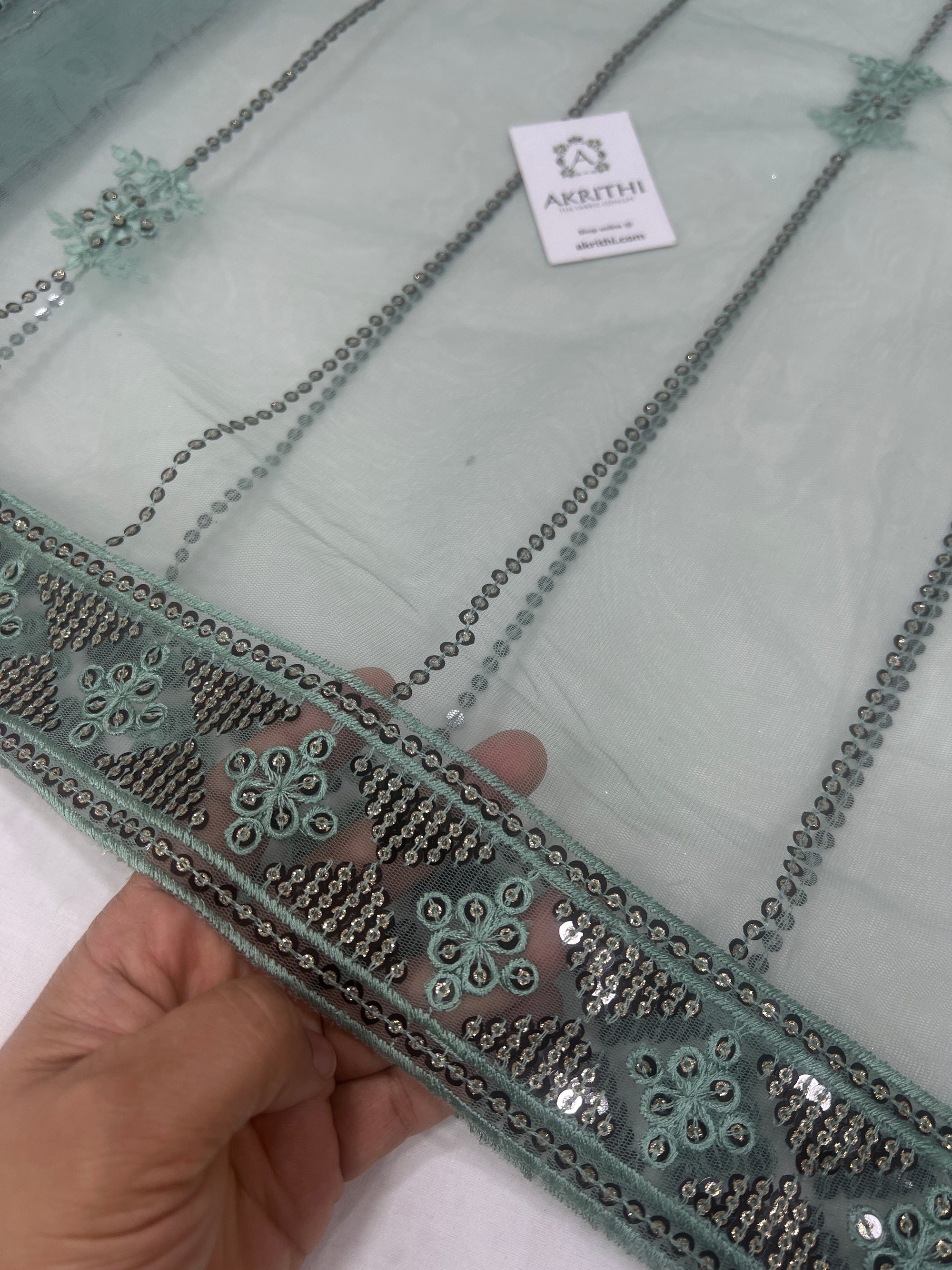 Embroidered net fabric