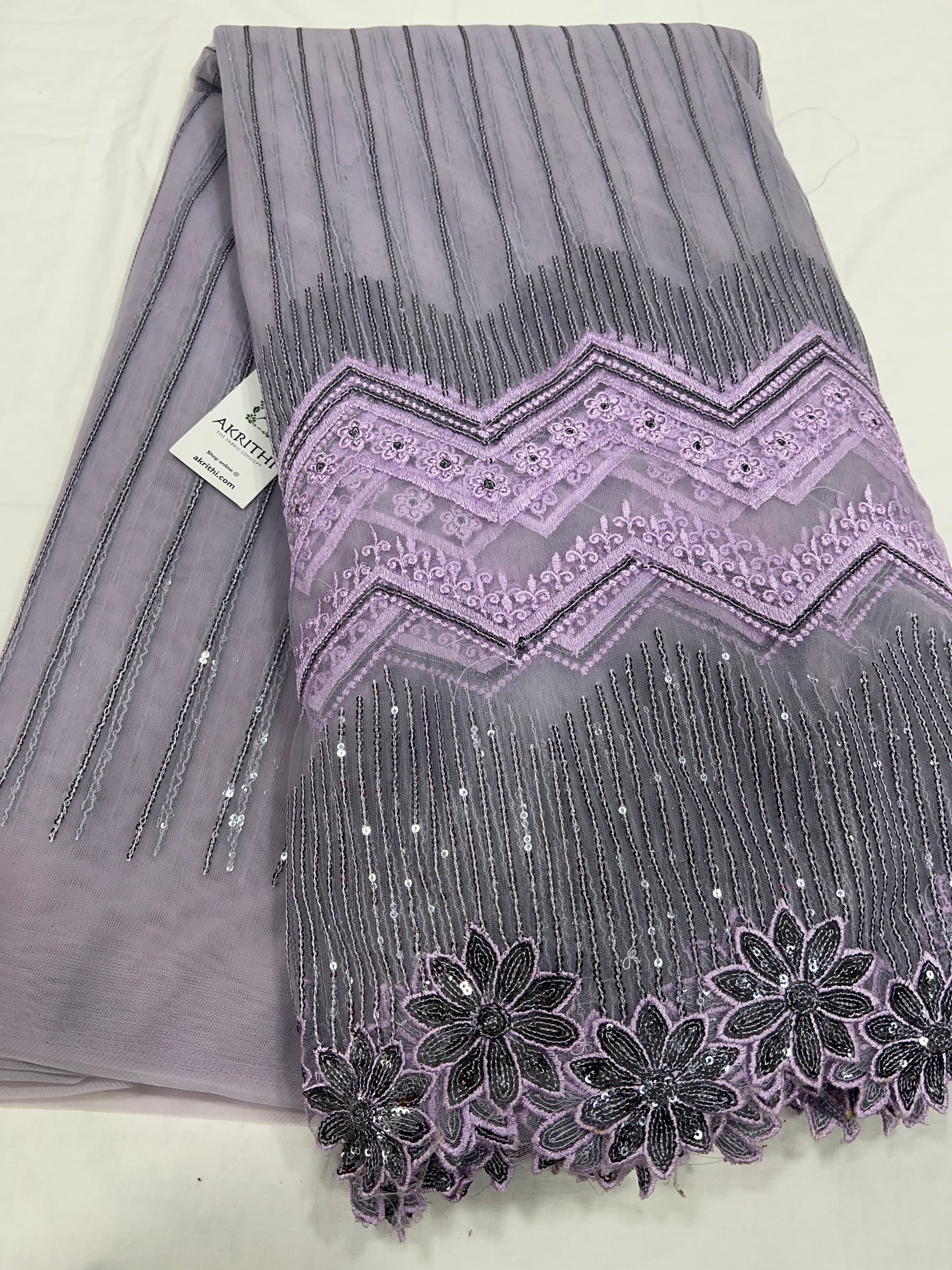 Embroidered net fabric