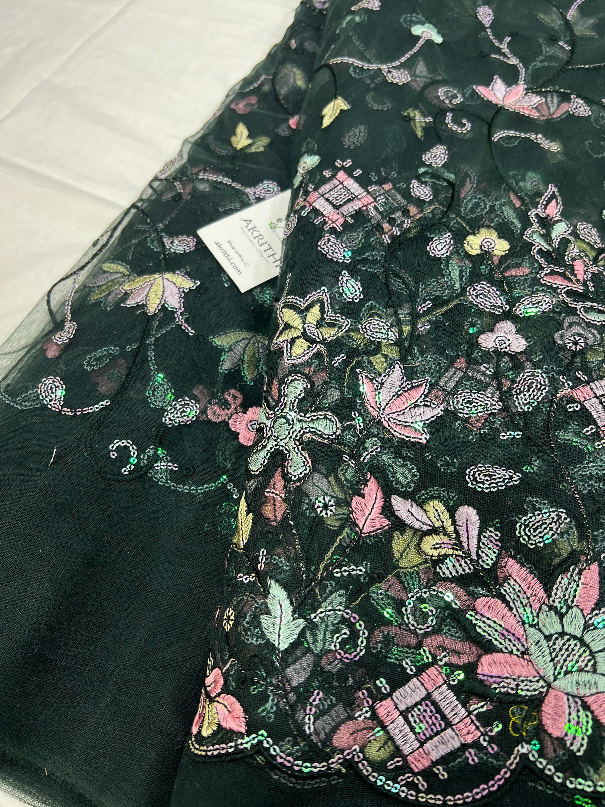 Embroidered net fabric