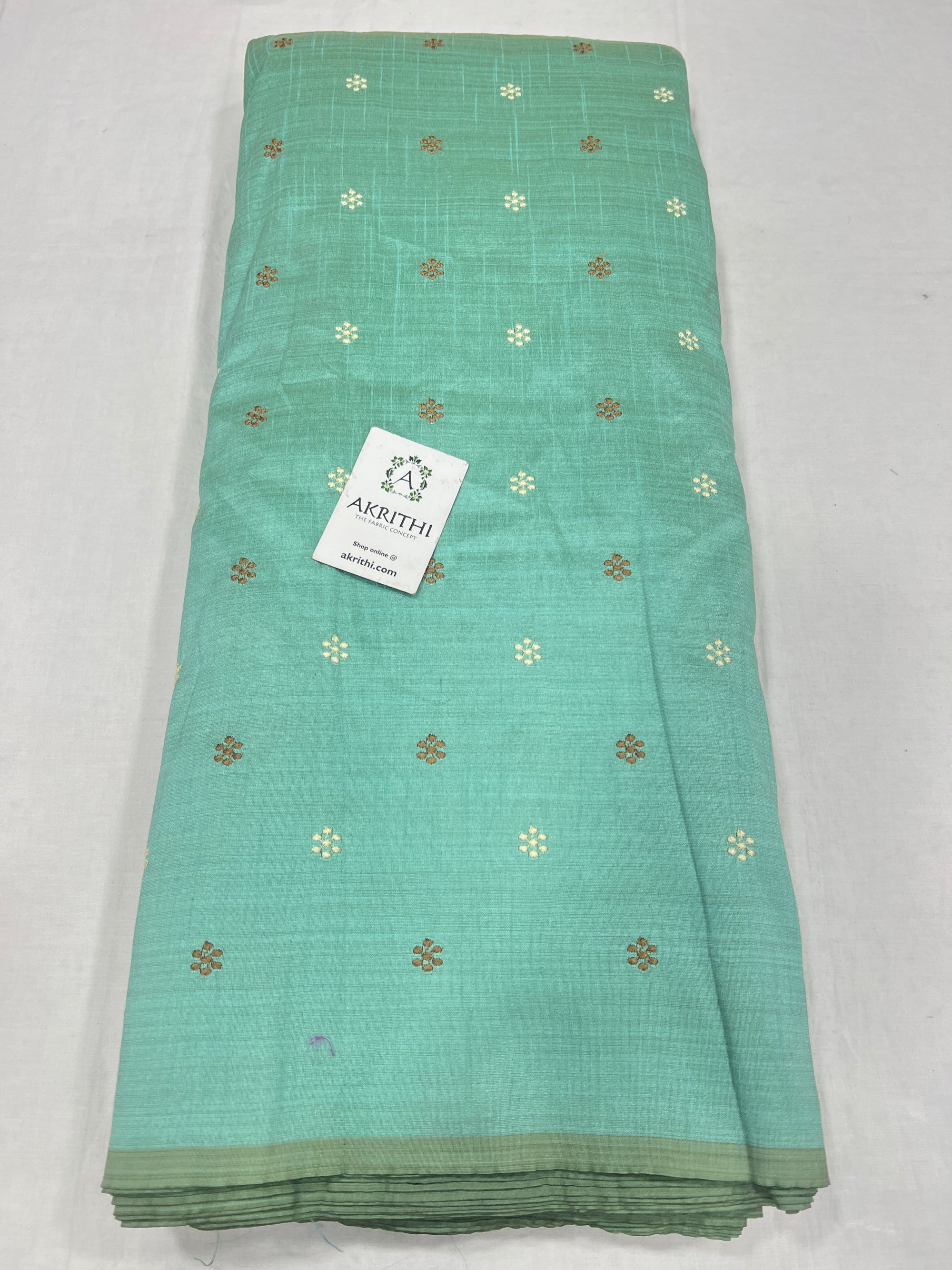 Embroidered raw silk fabric