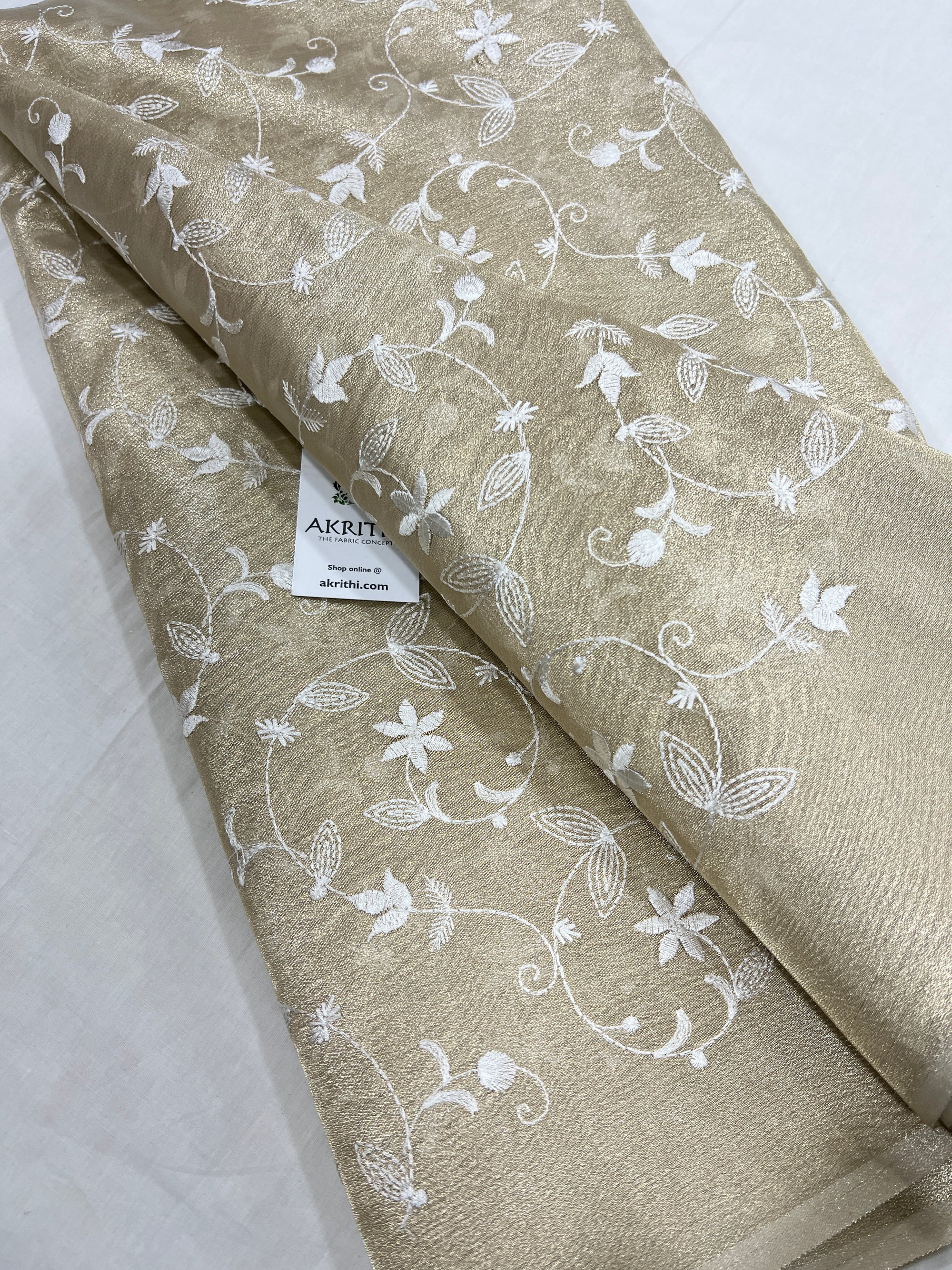 Embroidery on tissue fabric