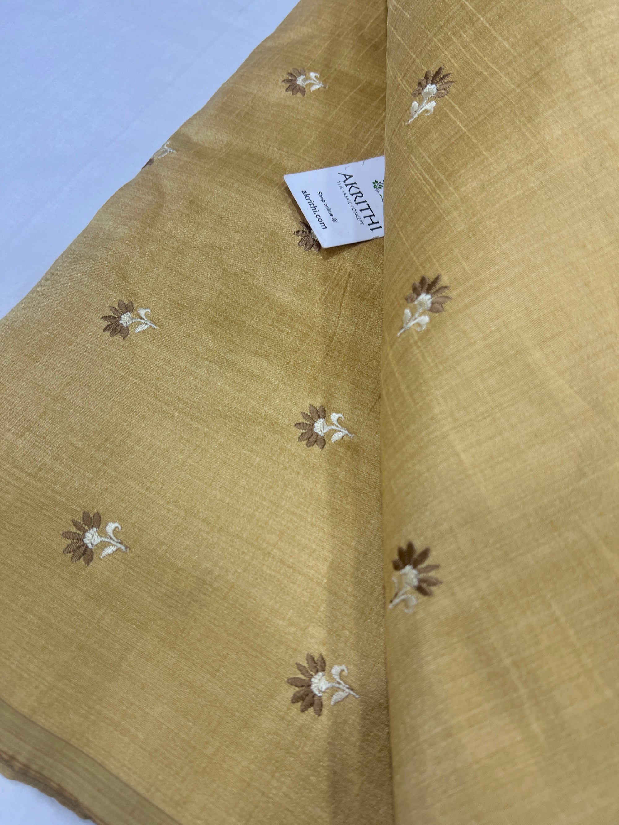 Embroidered raw silk fabric