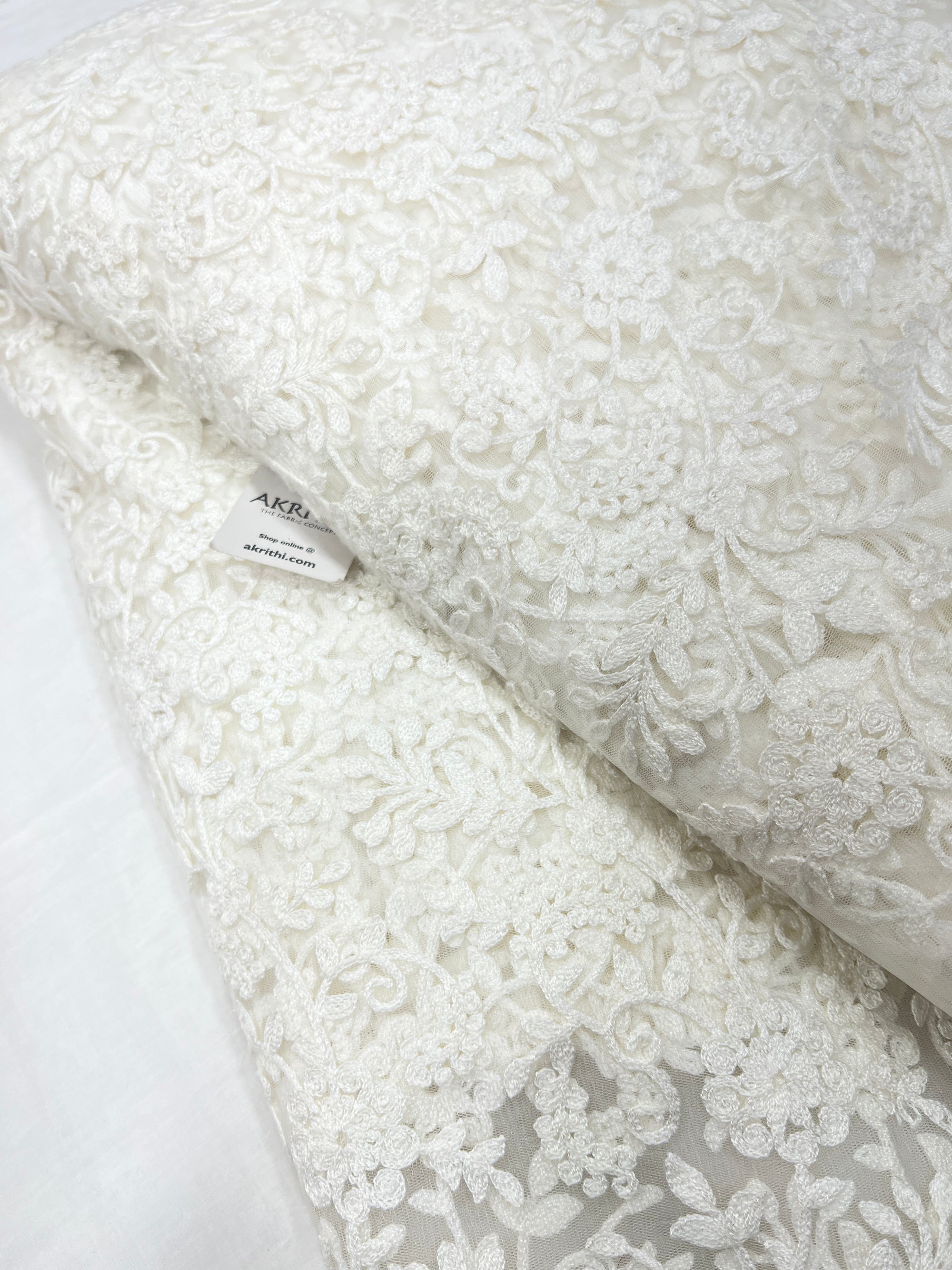 Embroidered net fabric