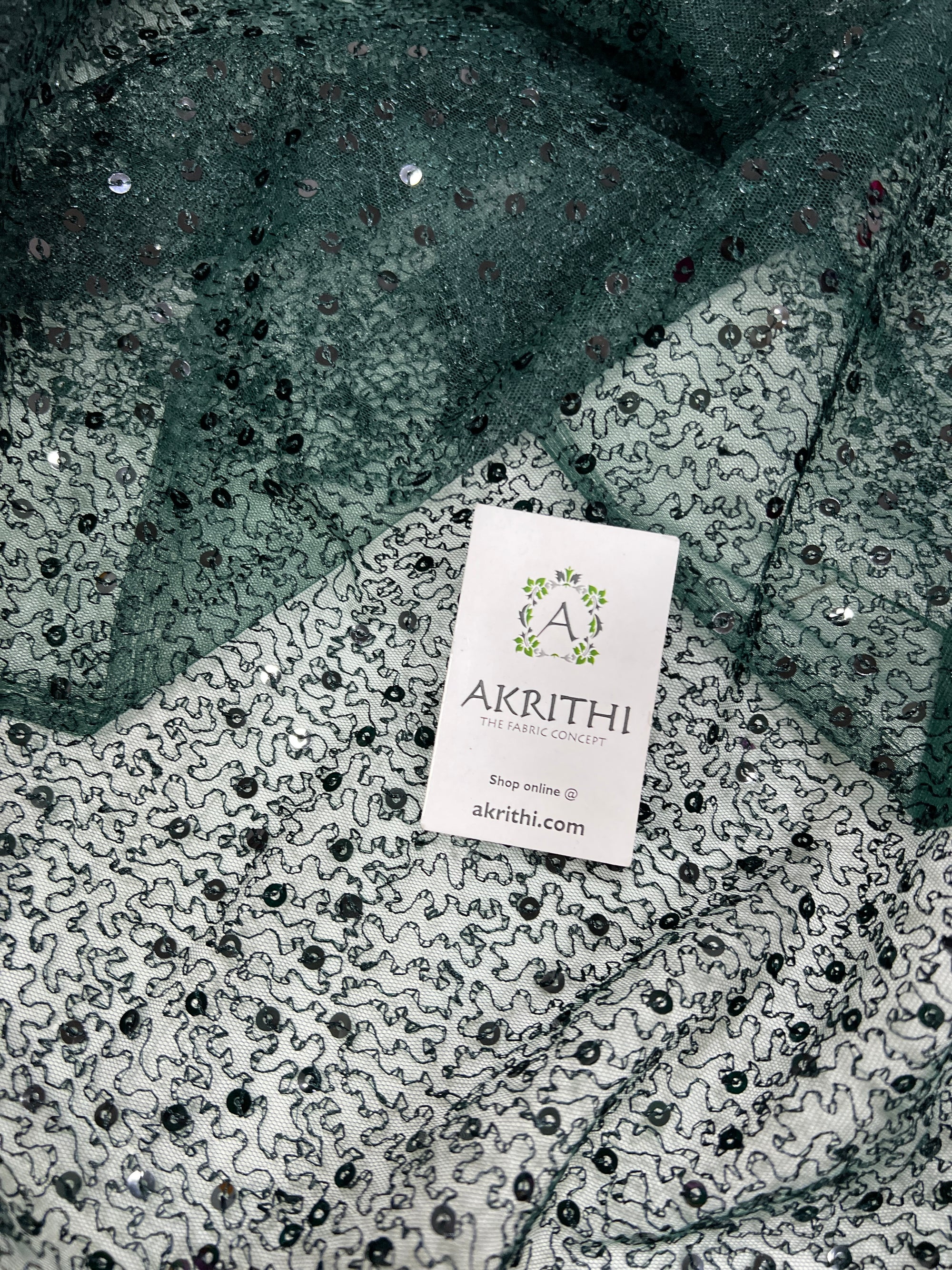 Self Embroidered net fabric