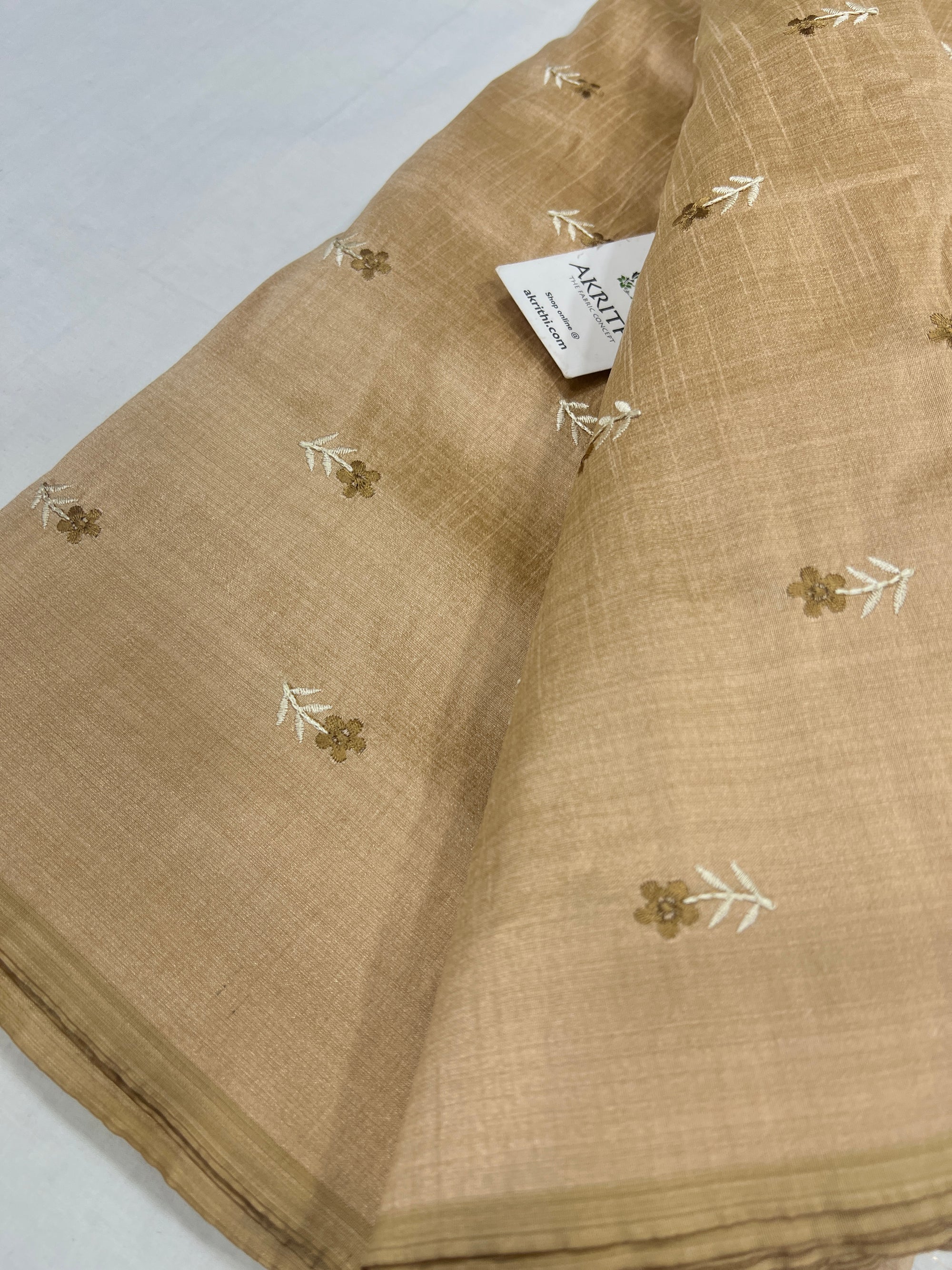 Embroidered raw silk fabric