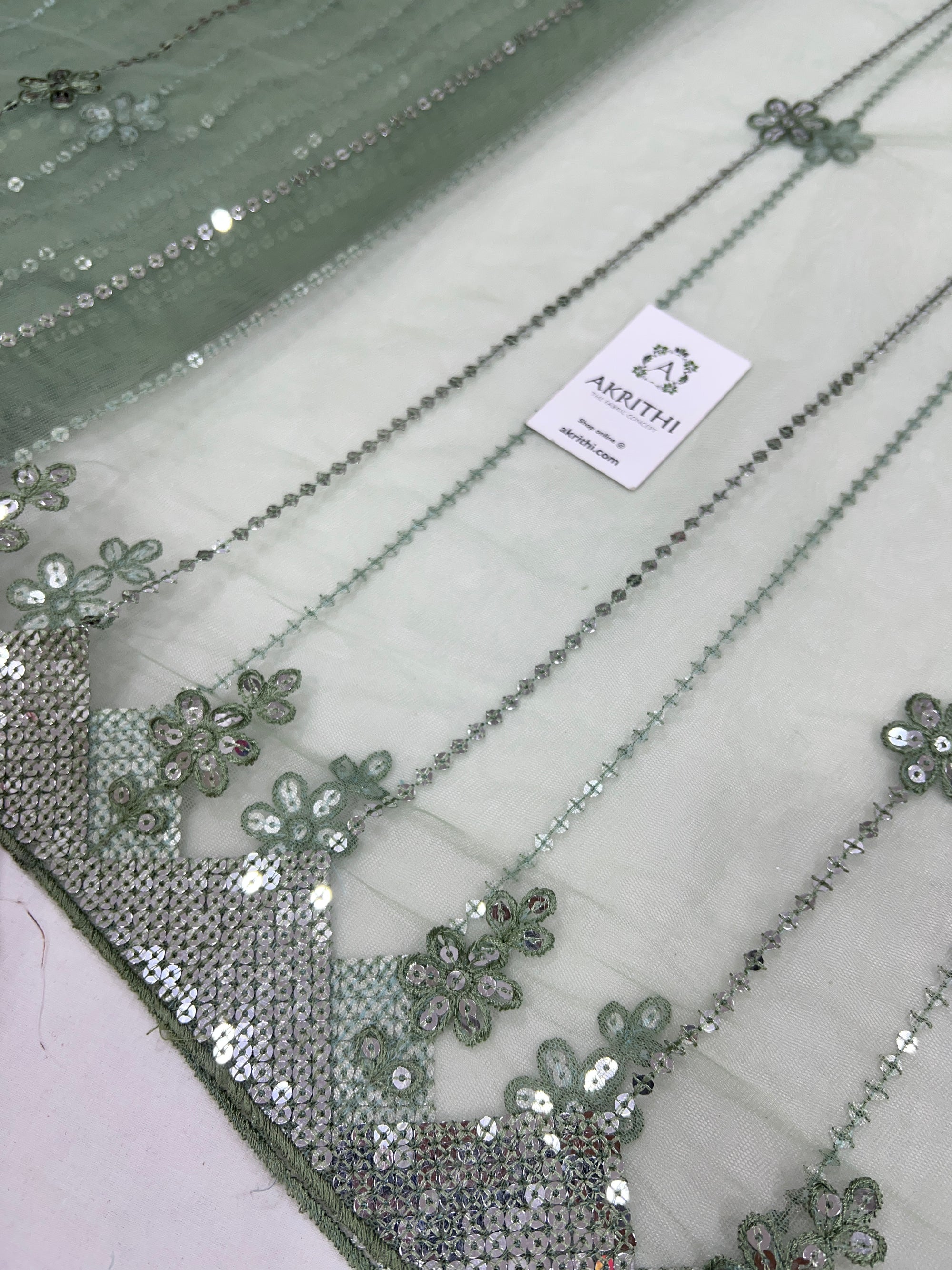 Embroidered net fabric