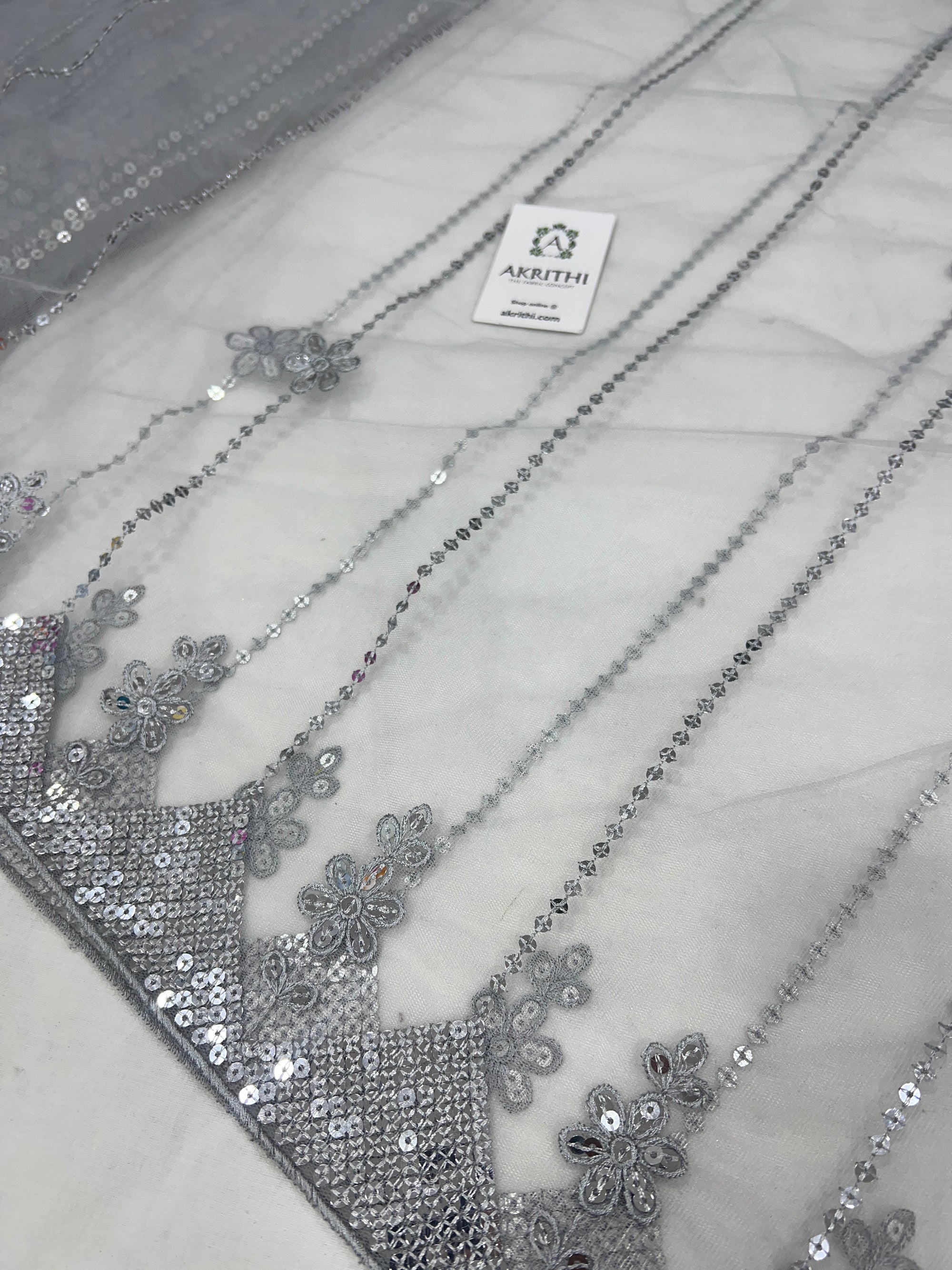 Embroidered net fabric