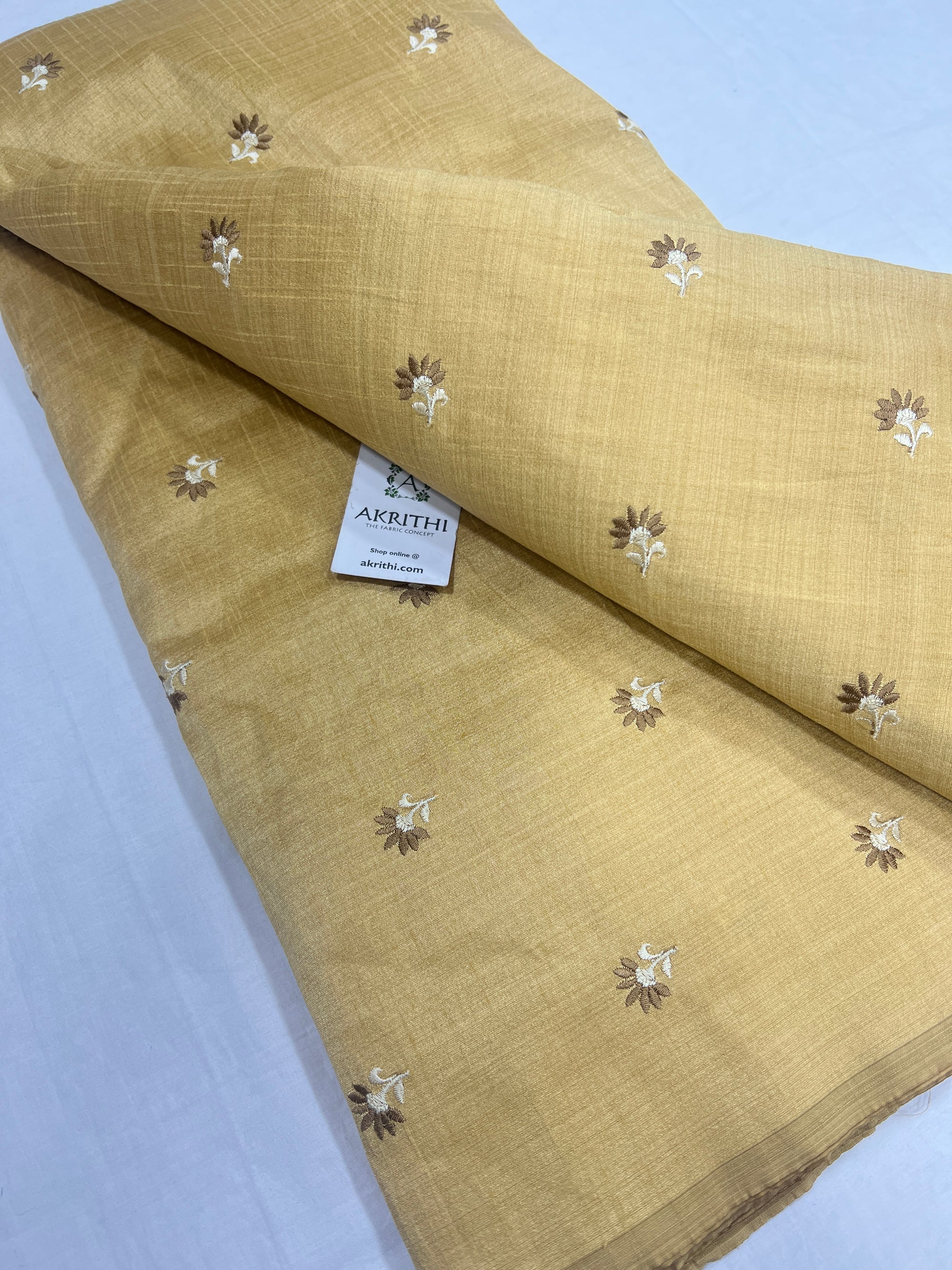Embroidered raw silk fabric