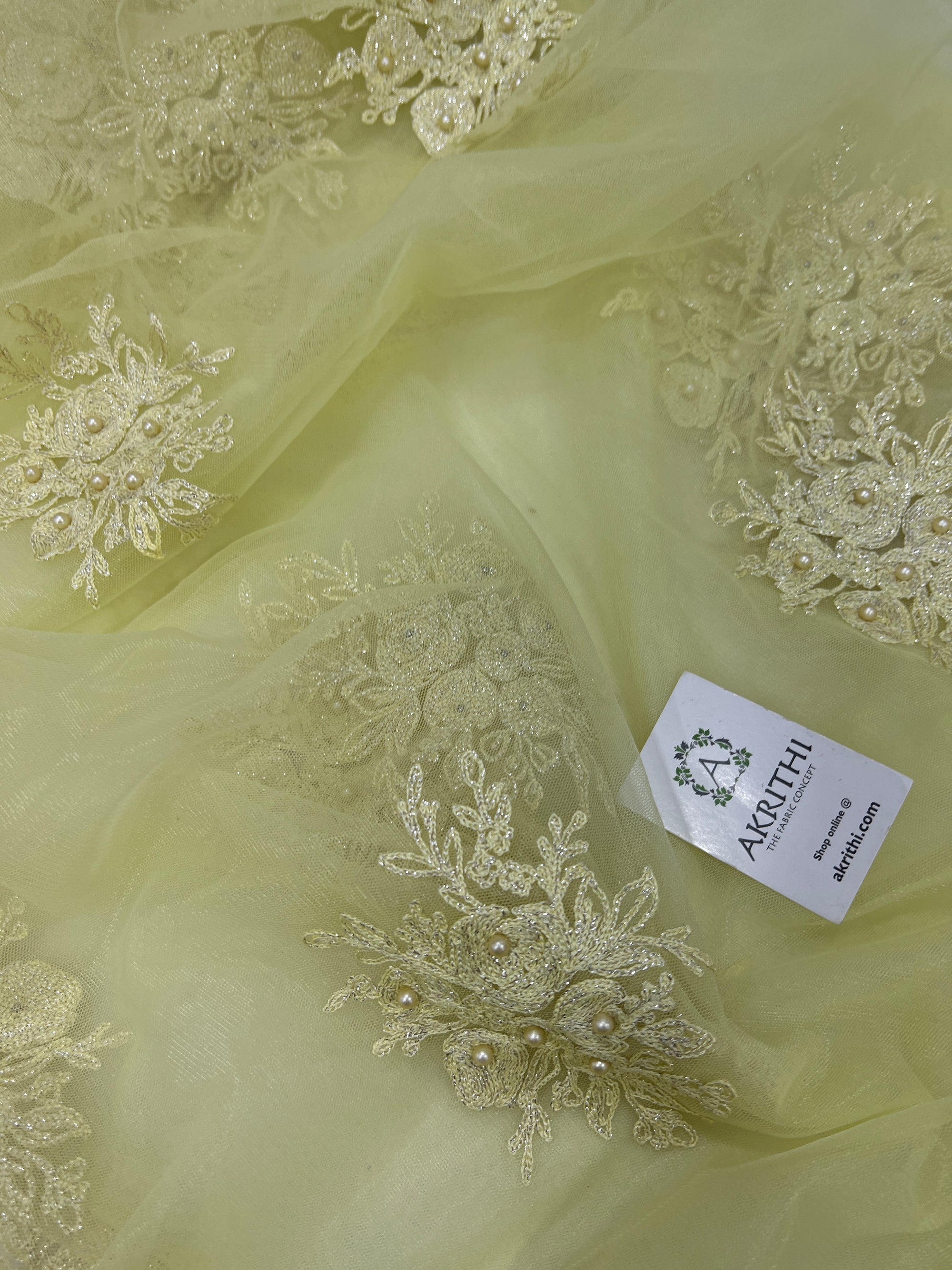 Embroidered net fabric