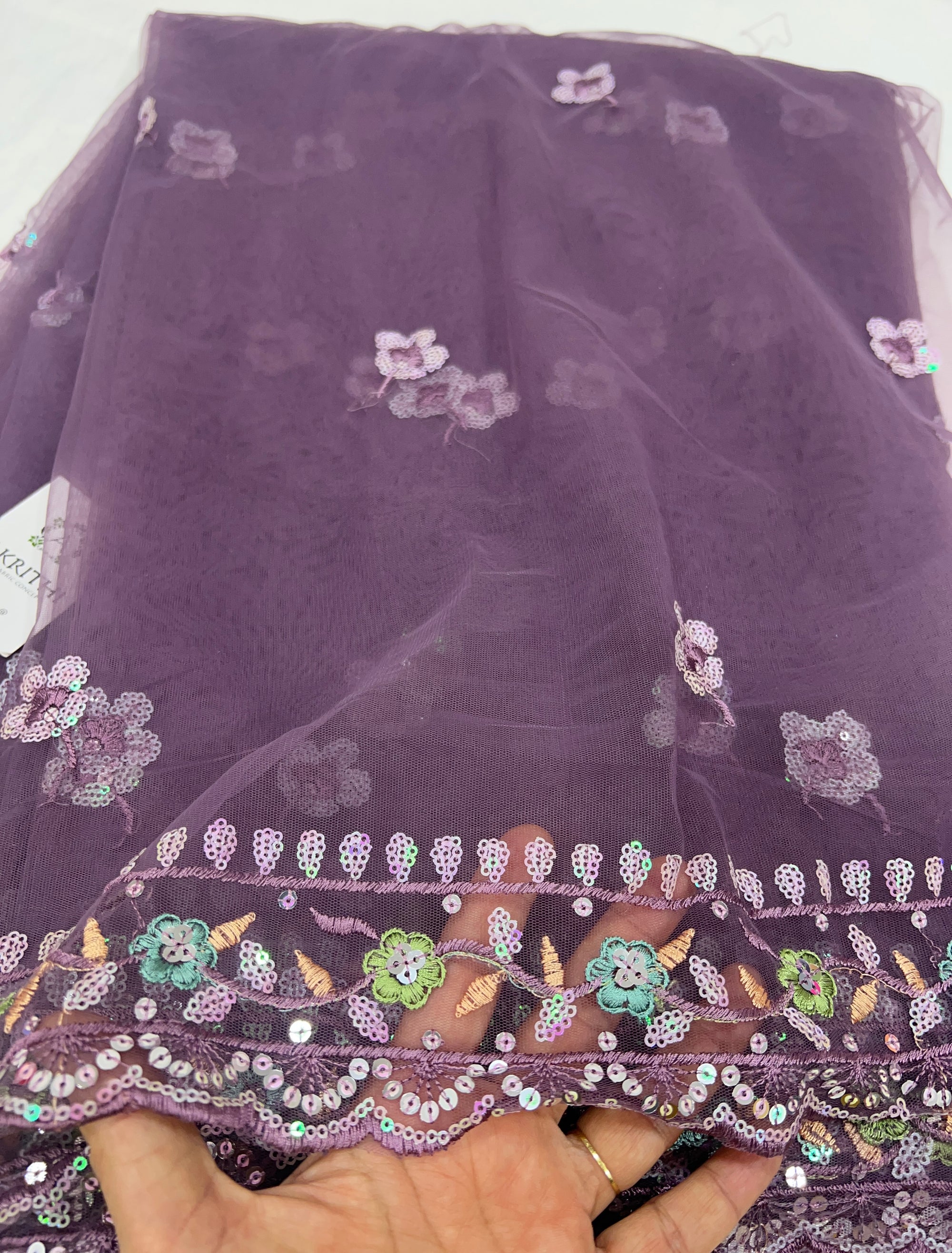 Embroidered net fabric