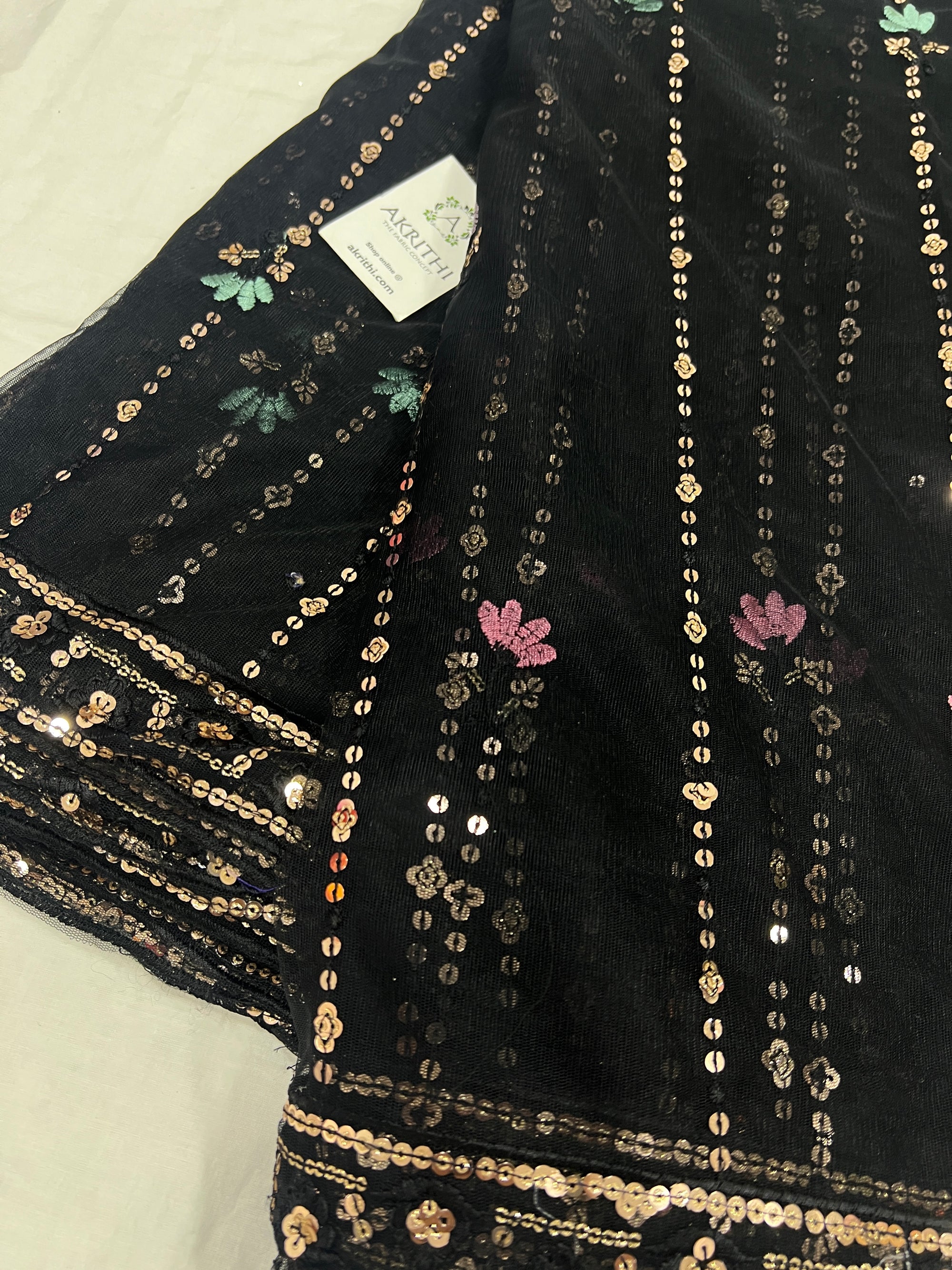 Embroidered net fabric