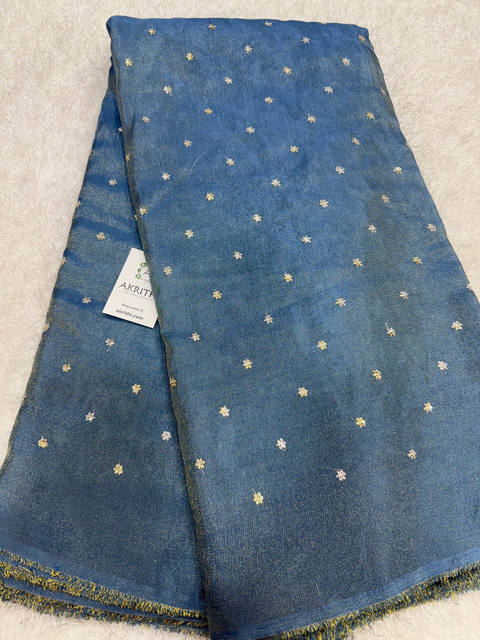 Sequins on tissue fabric