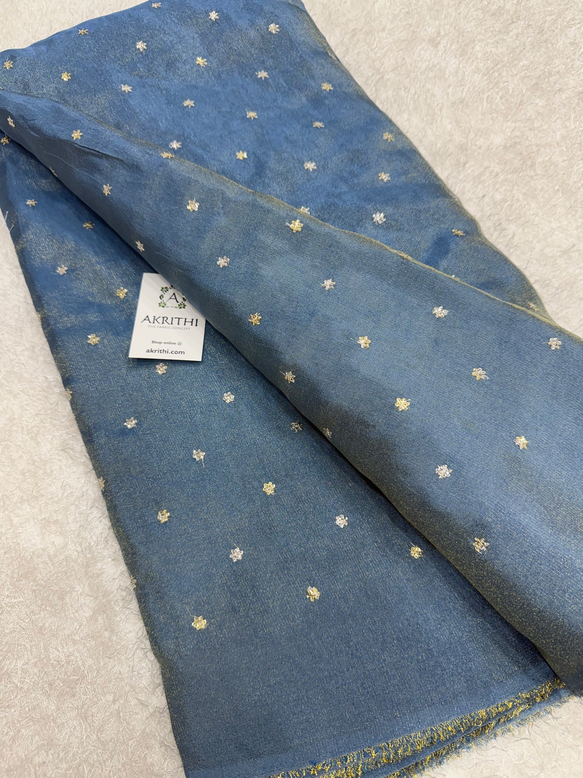 Sequins on tissue fabric