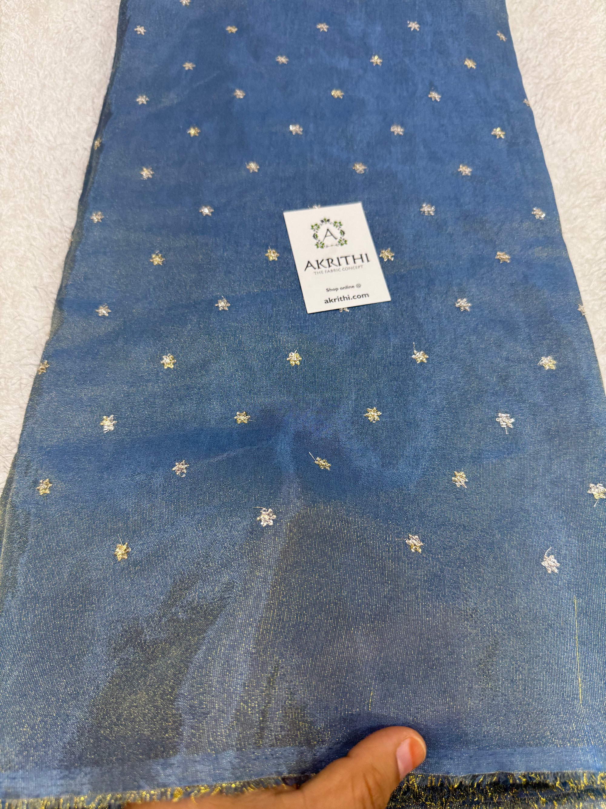 Sequins on tissue fabric