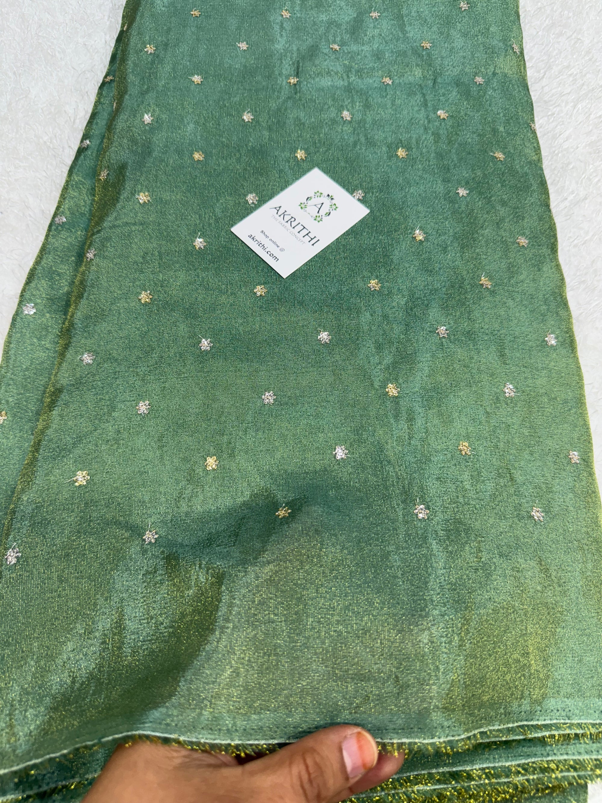Sequins on tissue fabric