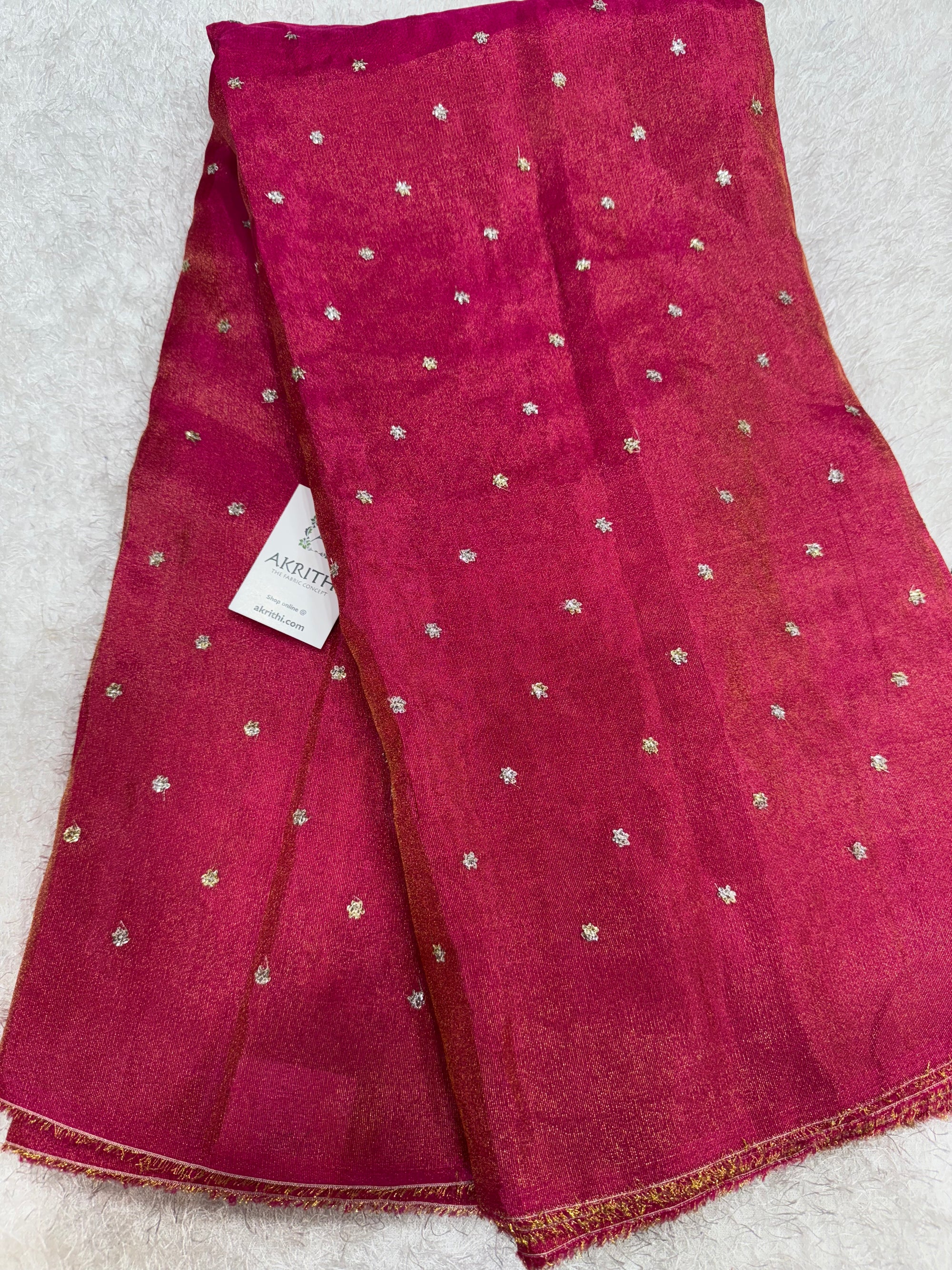 Sequins on tissue fabric