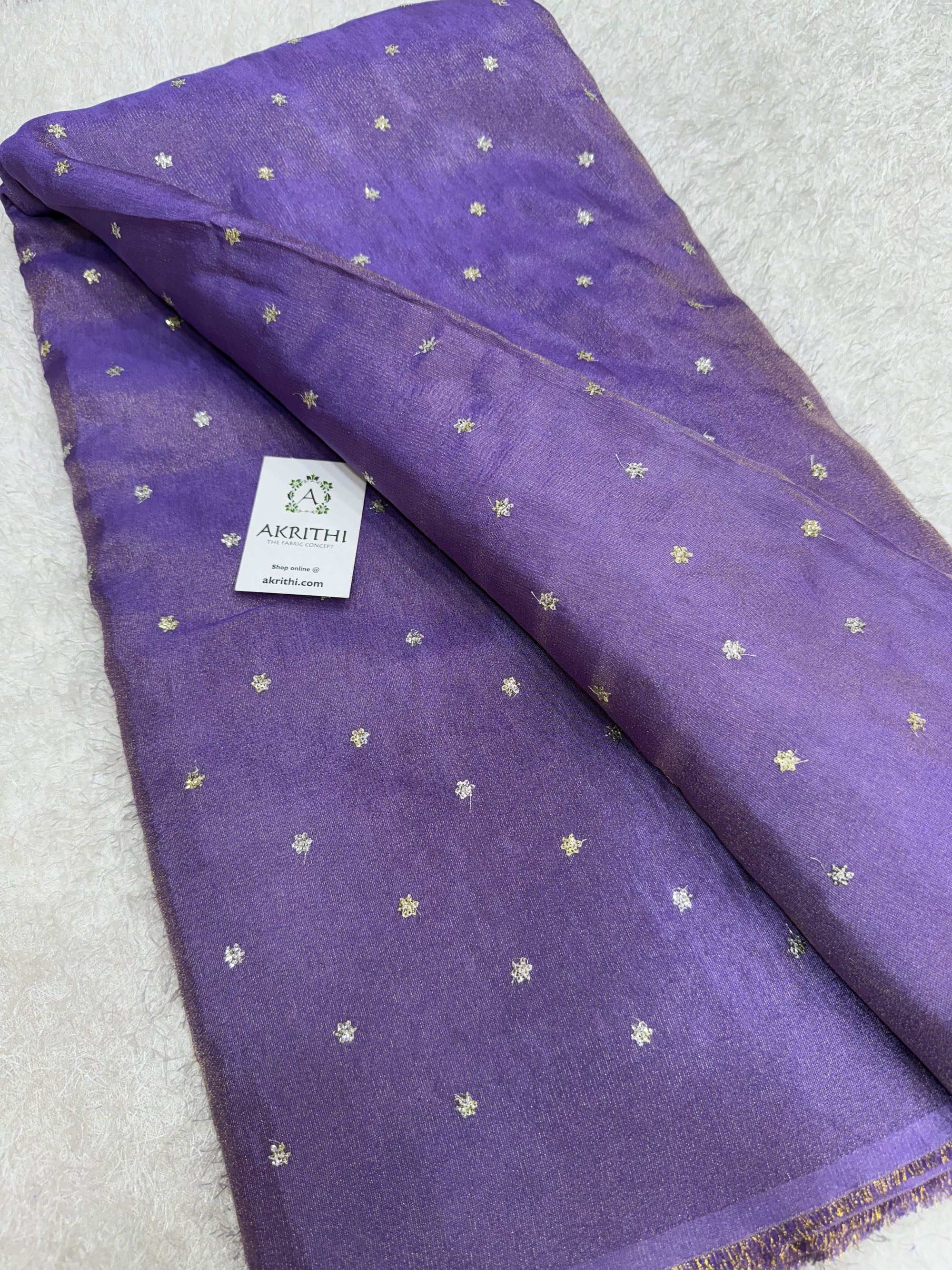 Sequins on tissue fabric