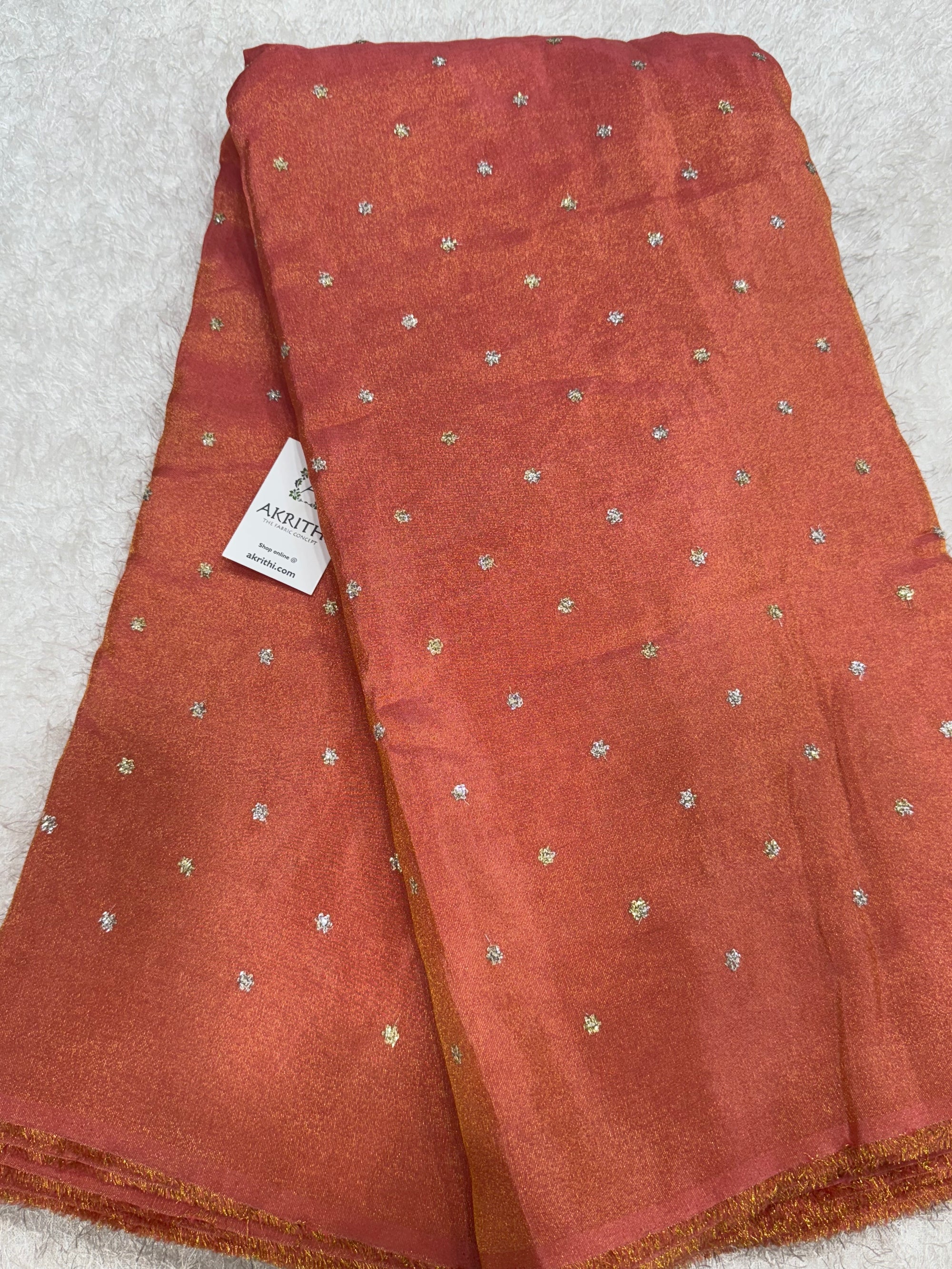 Sequins on tissue fabric