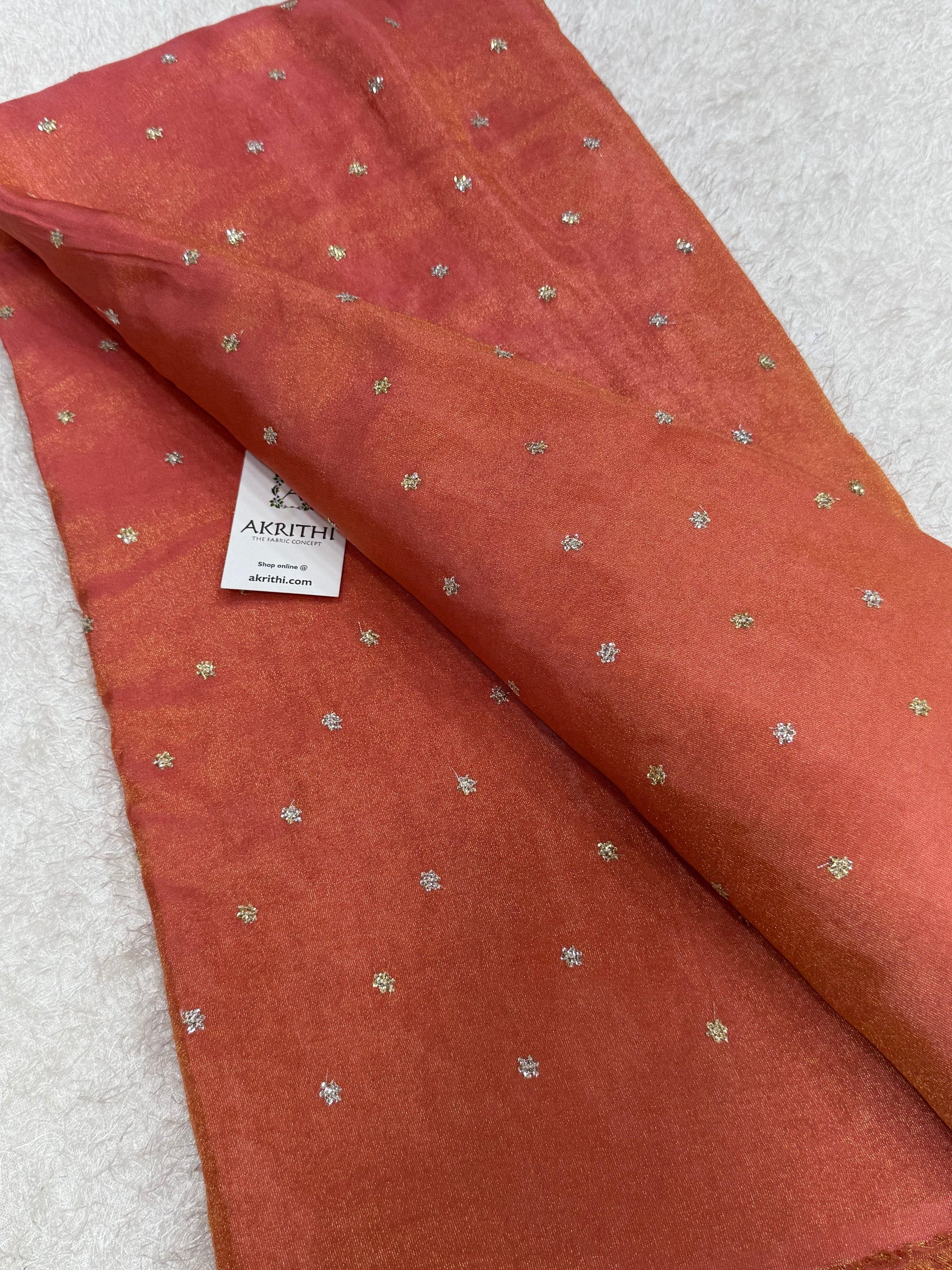 Sequins on tissue fabric