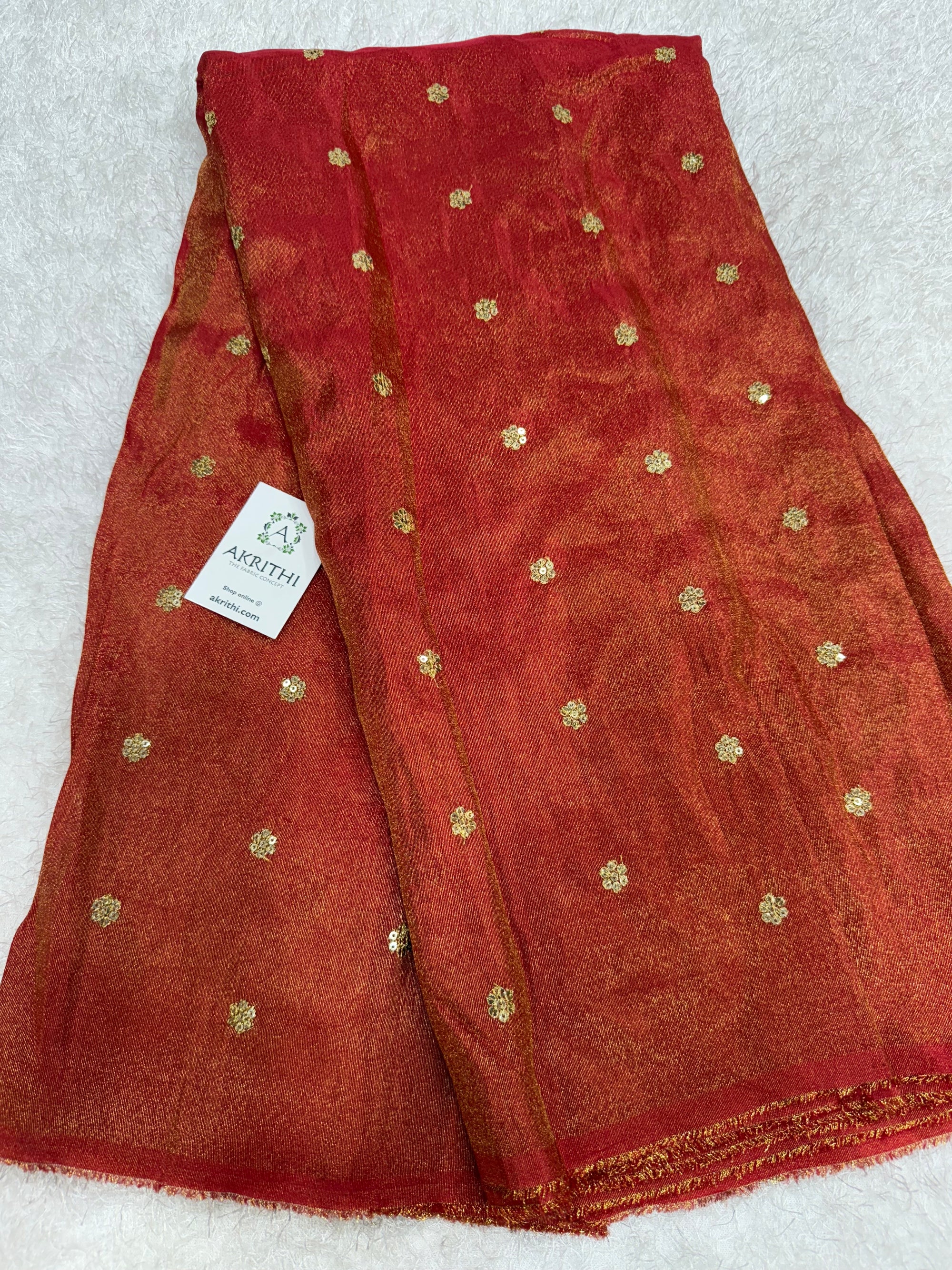 Sequins on tissue fabric