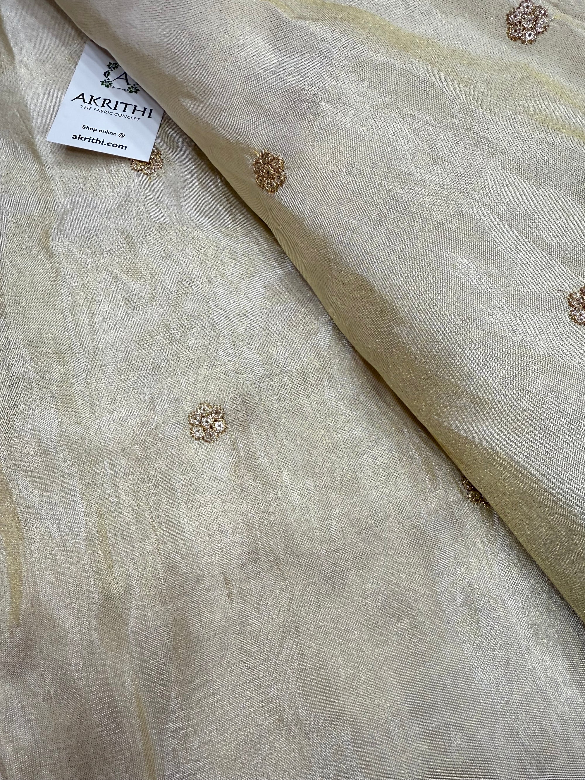 Sequins on dyeable tissue fabric