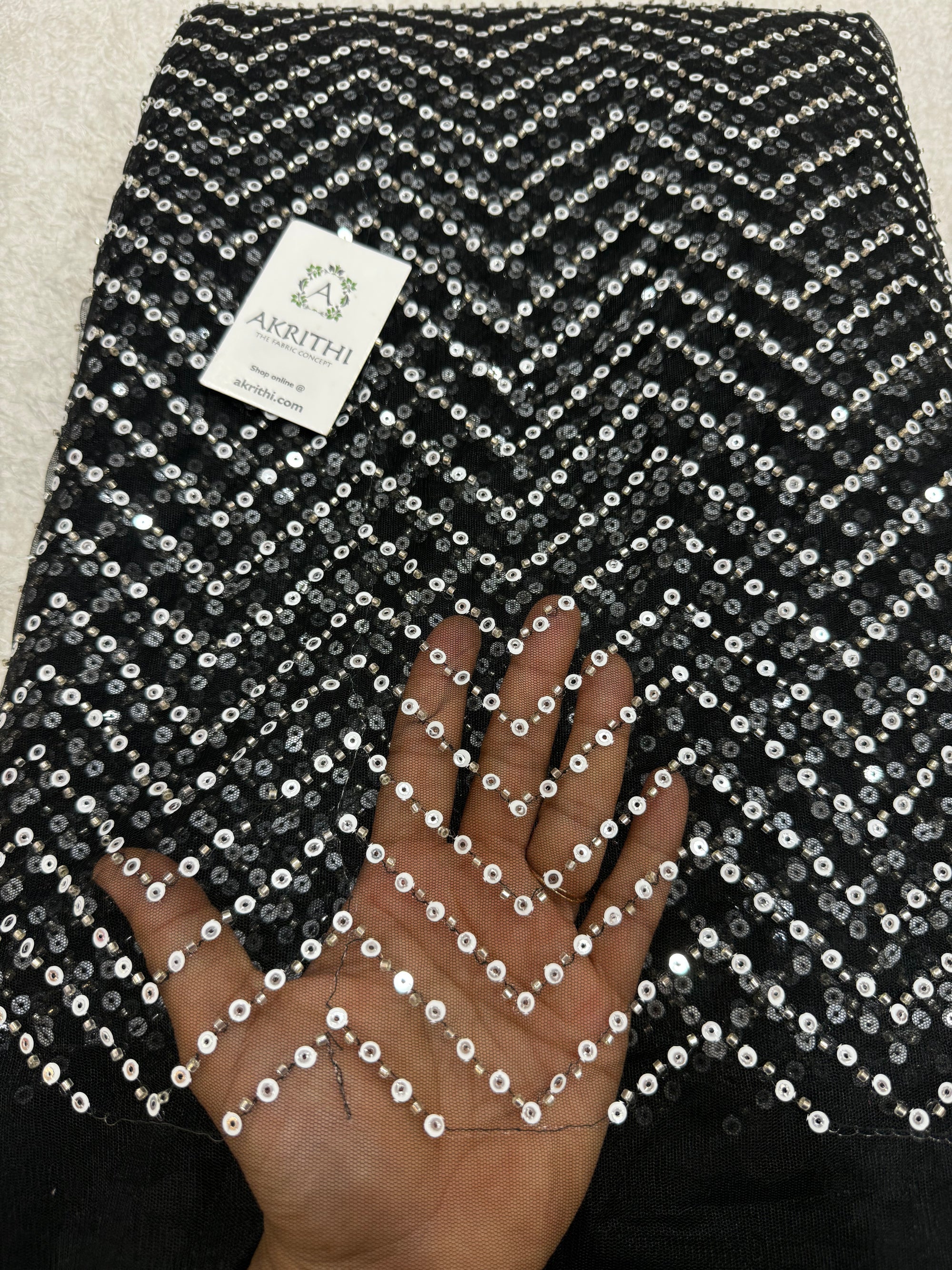 Embroidered net fabric