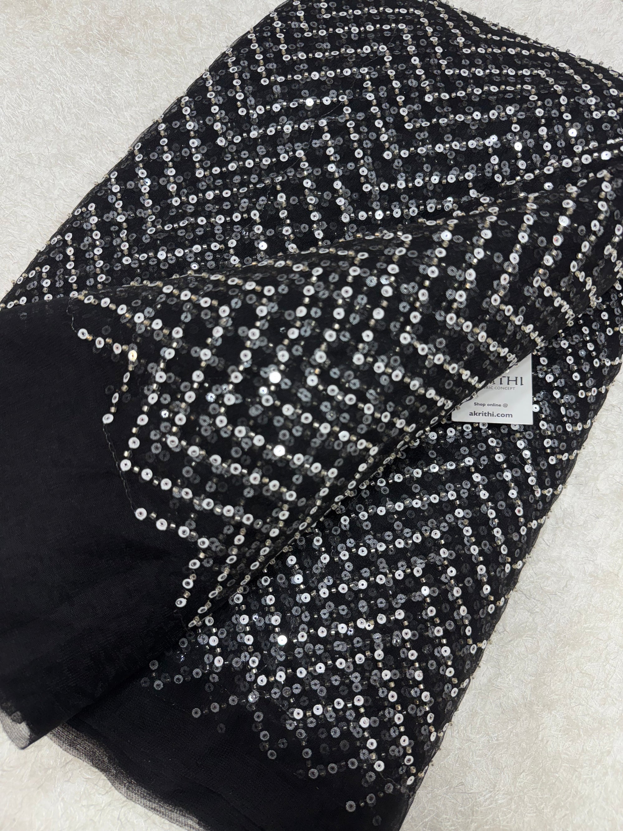 Embroidered net fabric