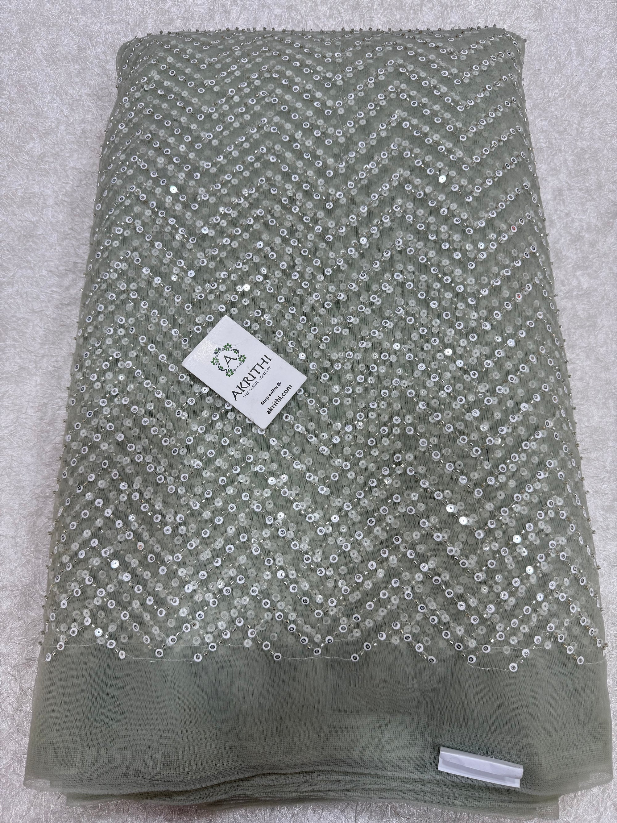 Embroidered net fabric