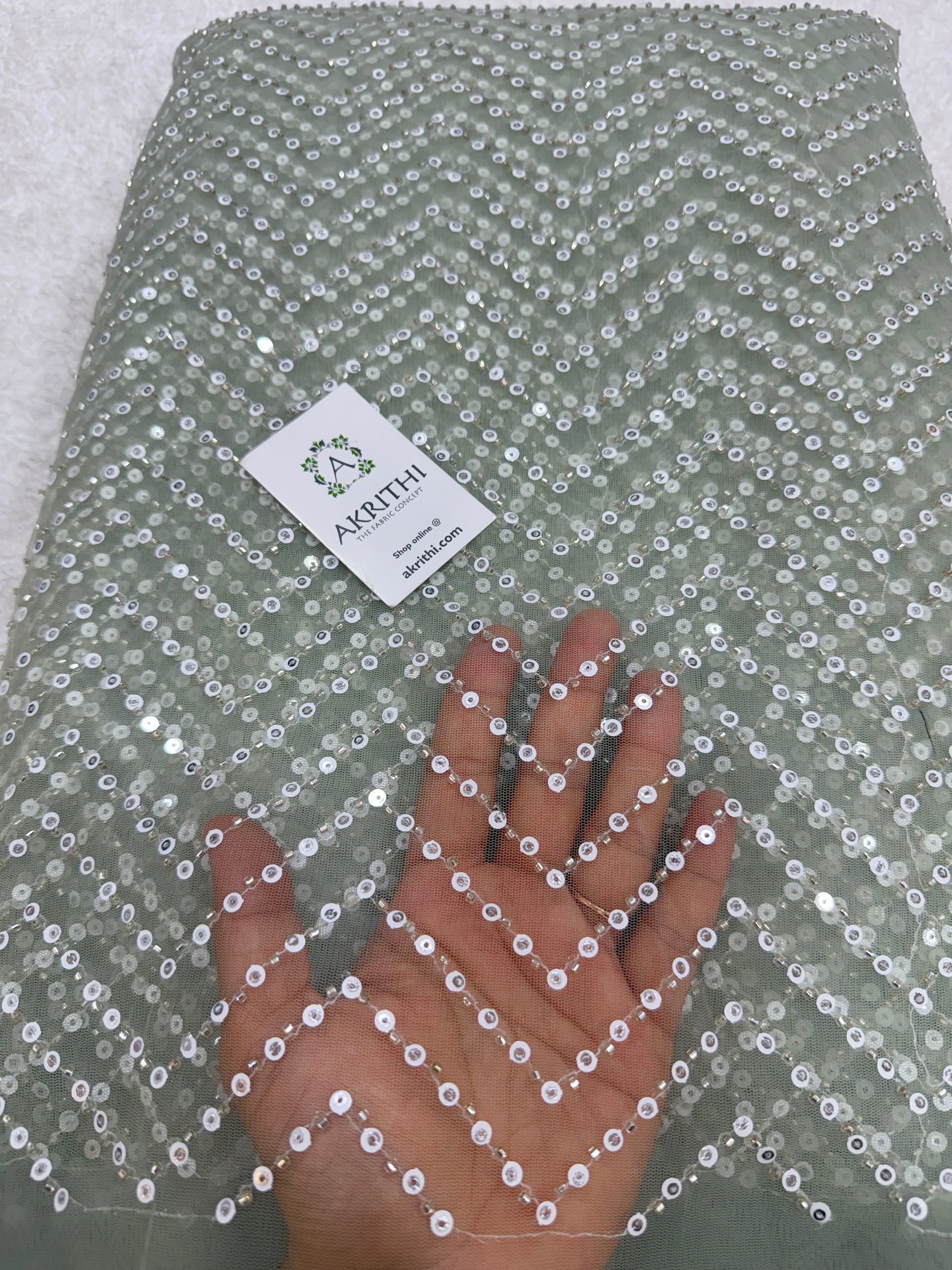 Embroidered net fabric