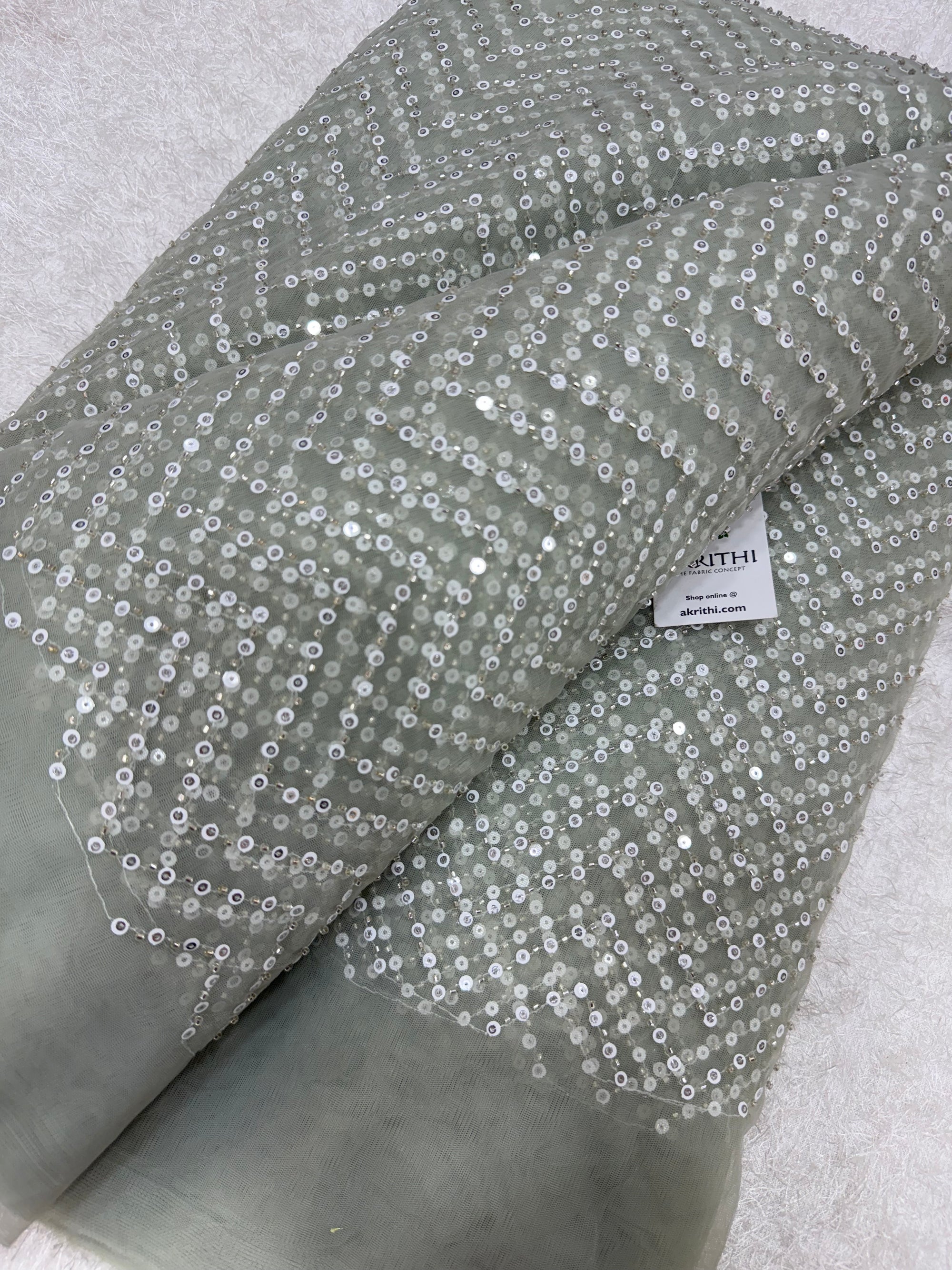 Embroidered net fabric