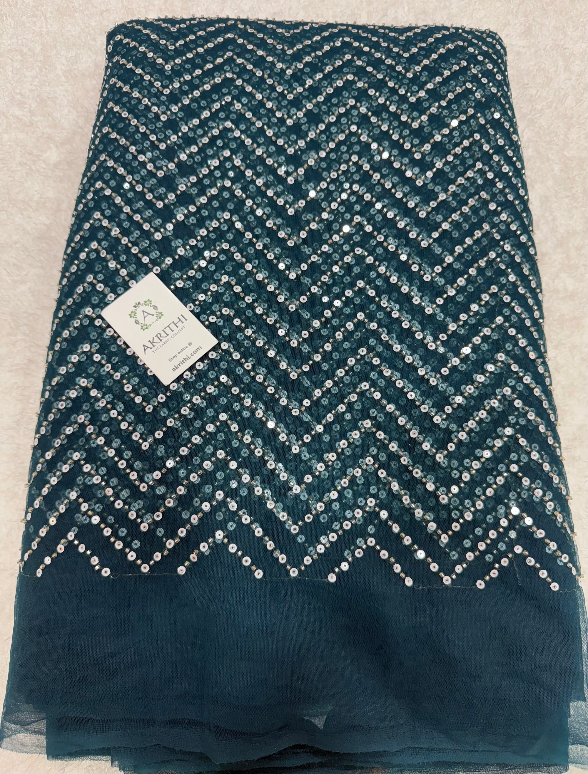 Embroidered net fabric