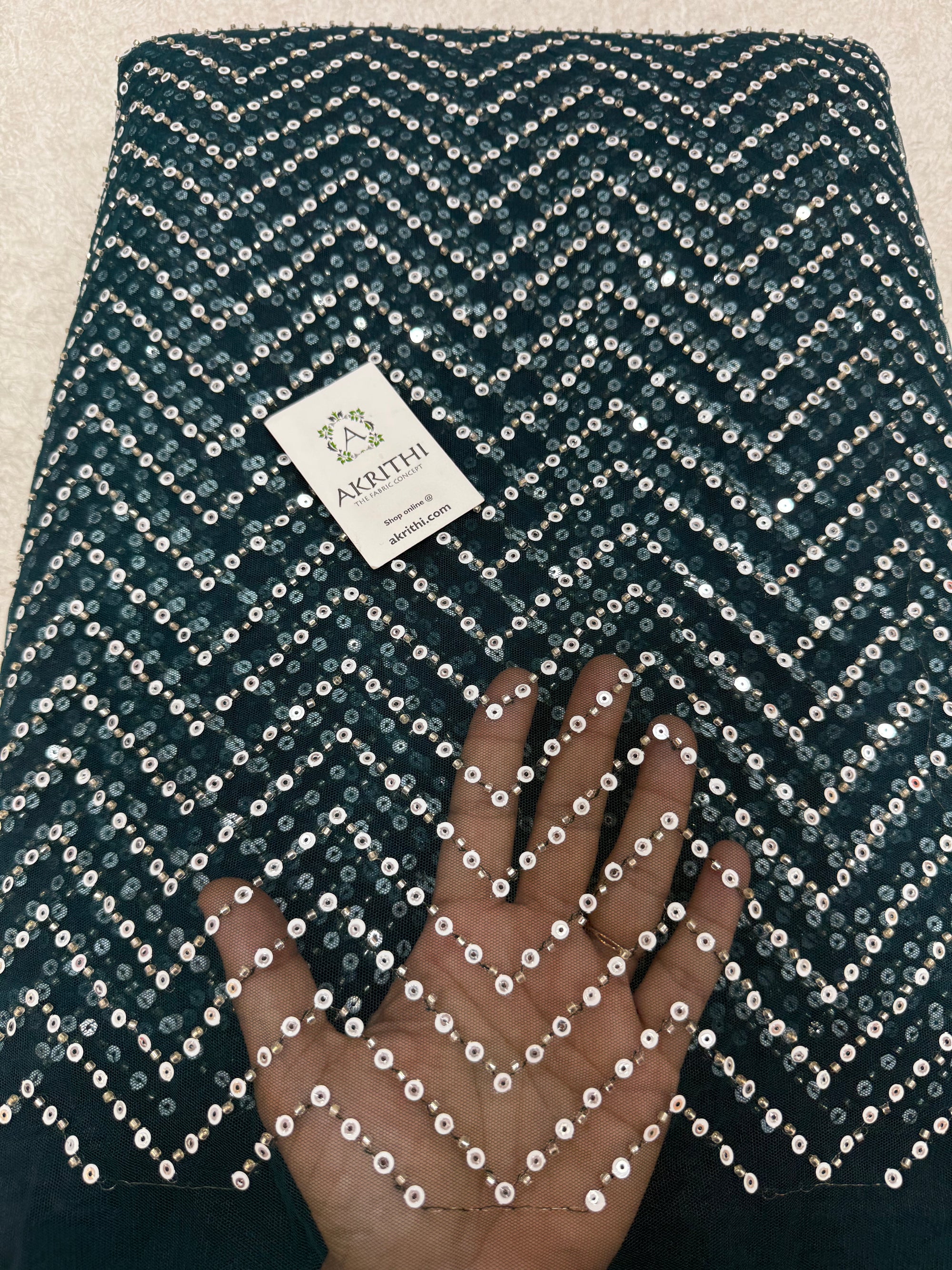 Embroidered net fabric