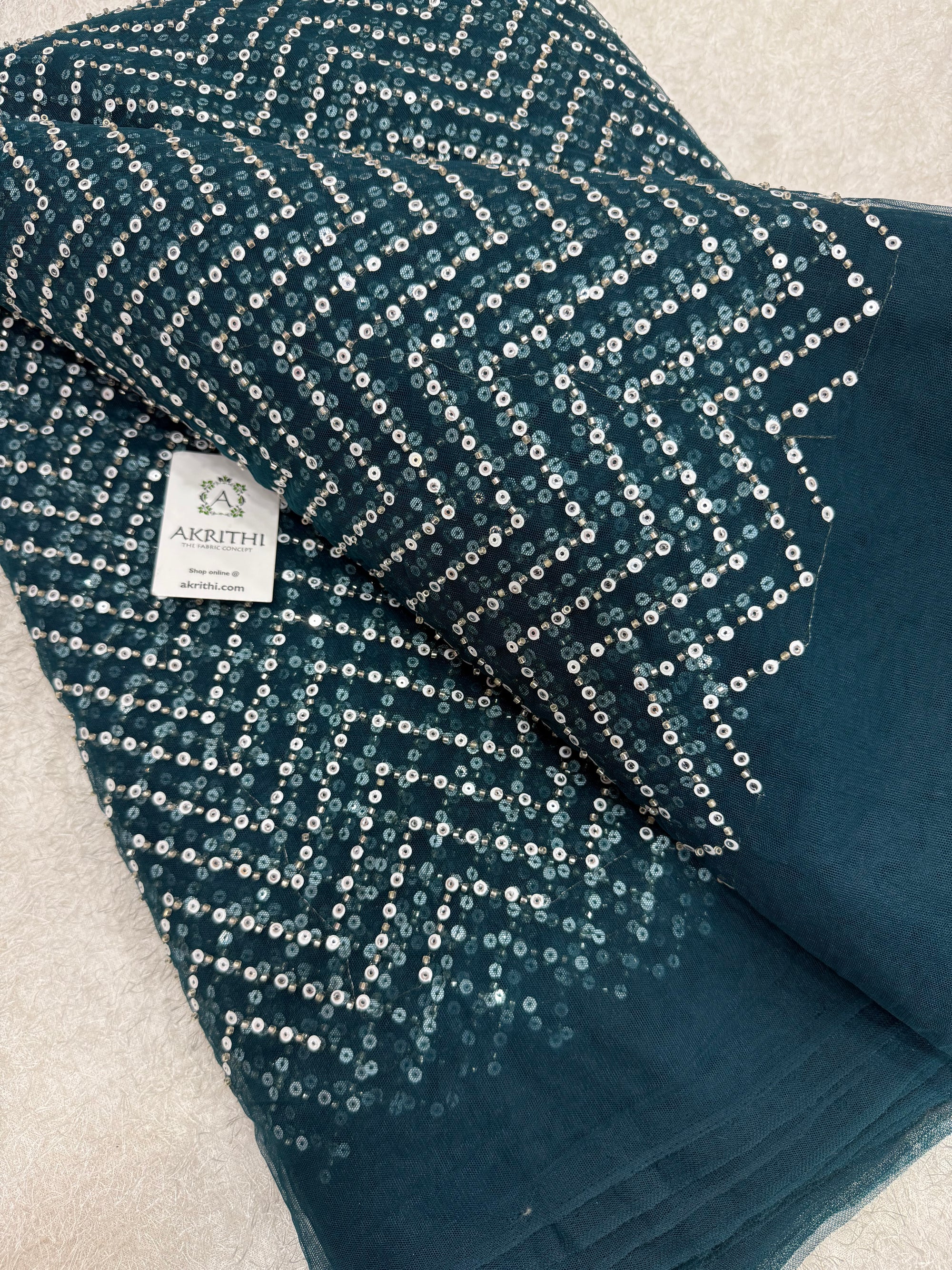 Embroidered net fabric