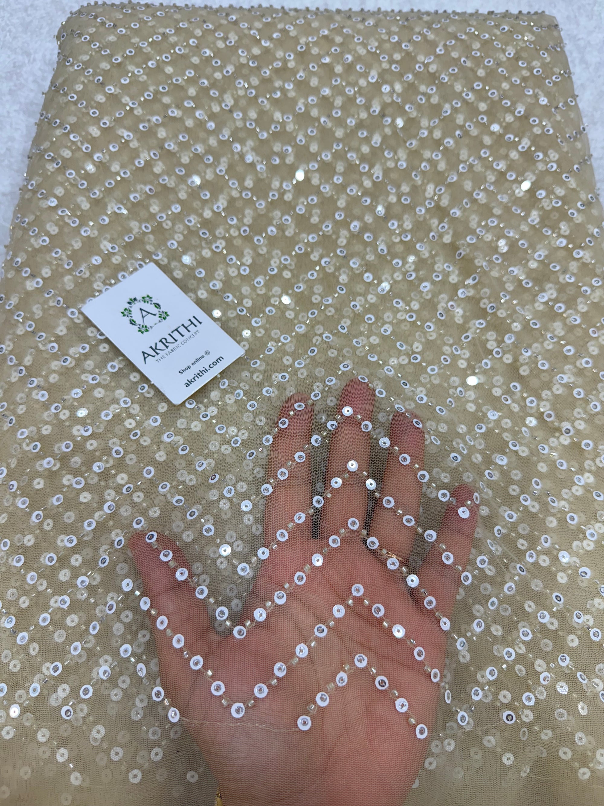 Embroidered net fabric