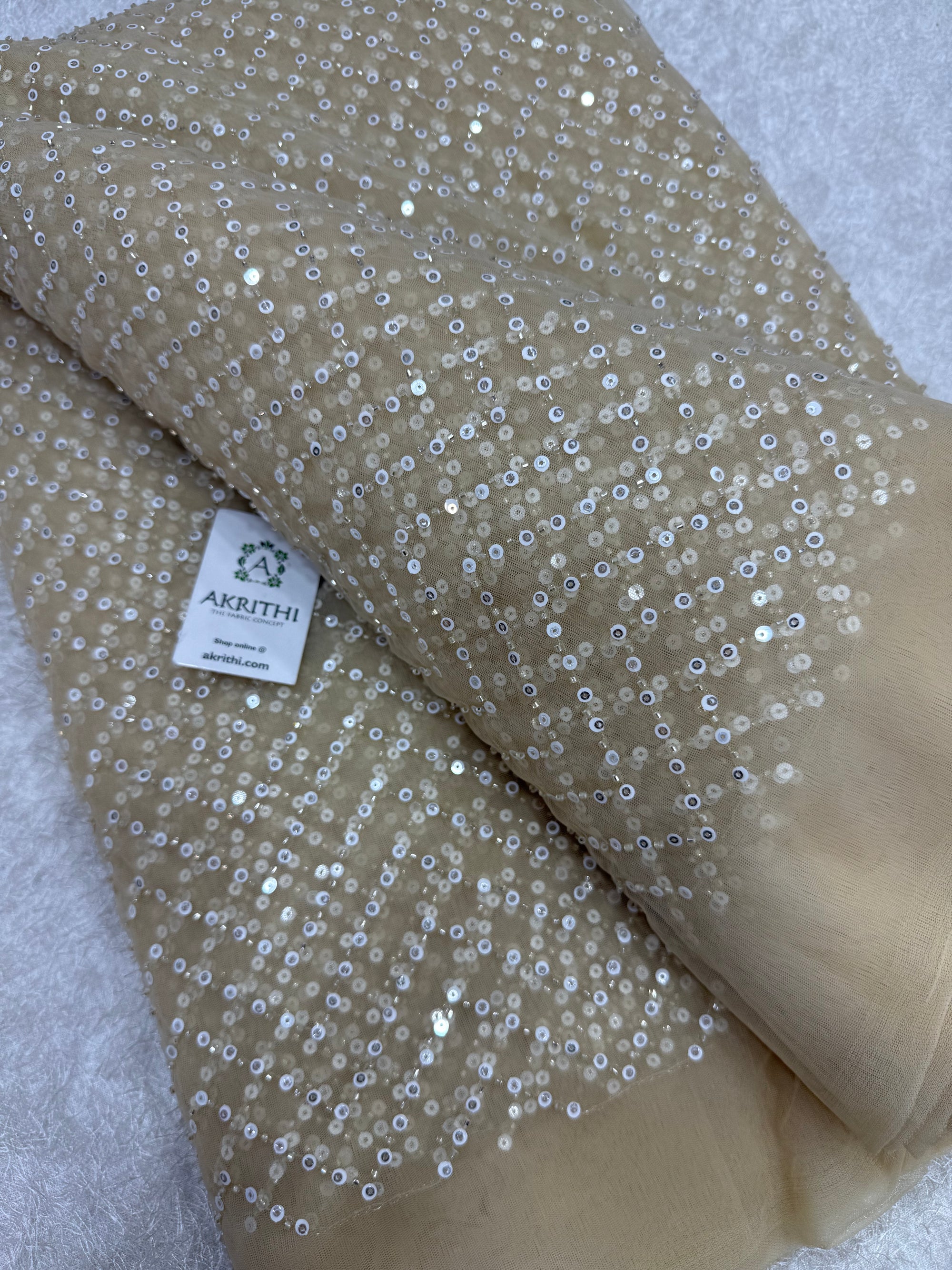 Embroidered net fabric