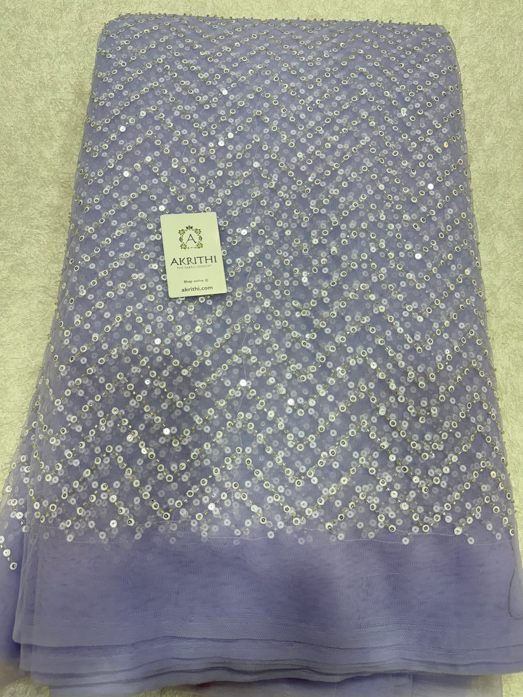 Embroidered net fabric