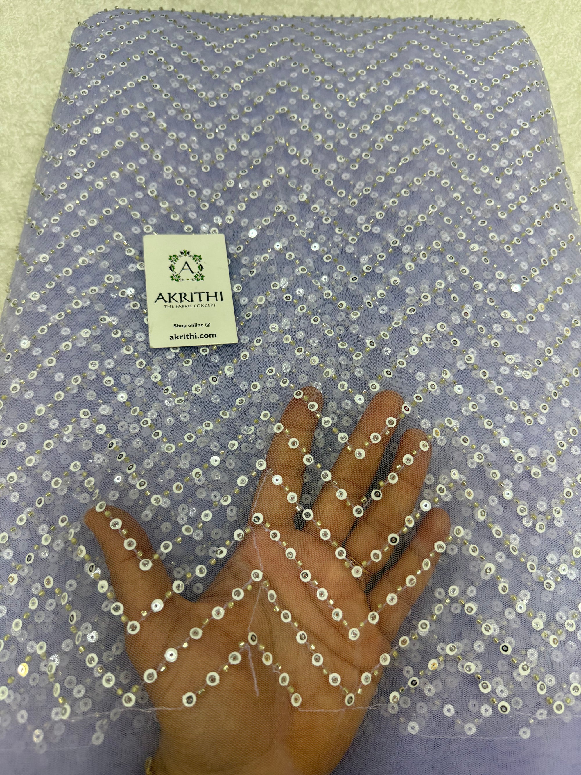 Embroidered net fabric