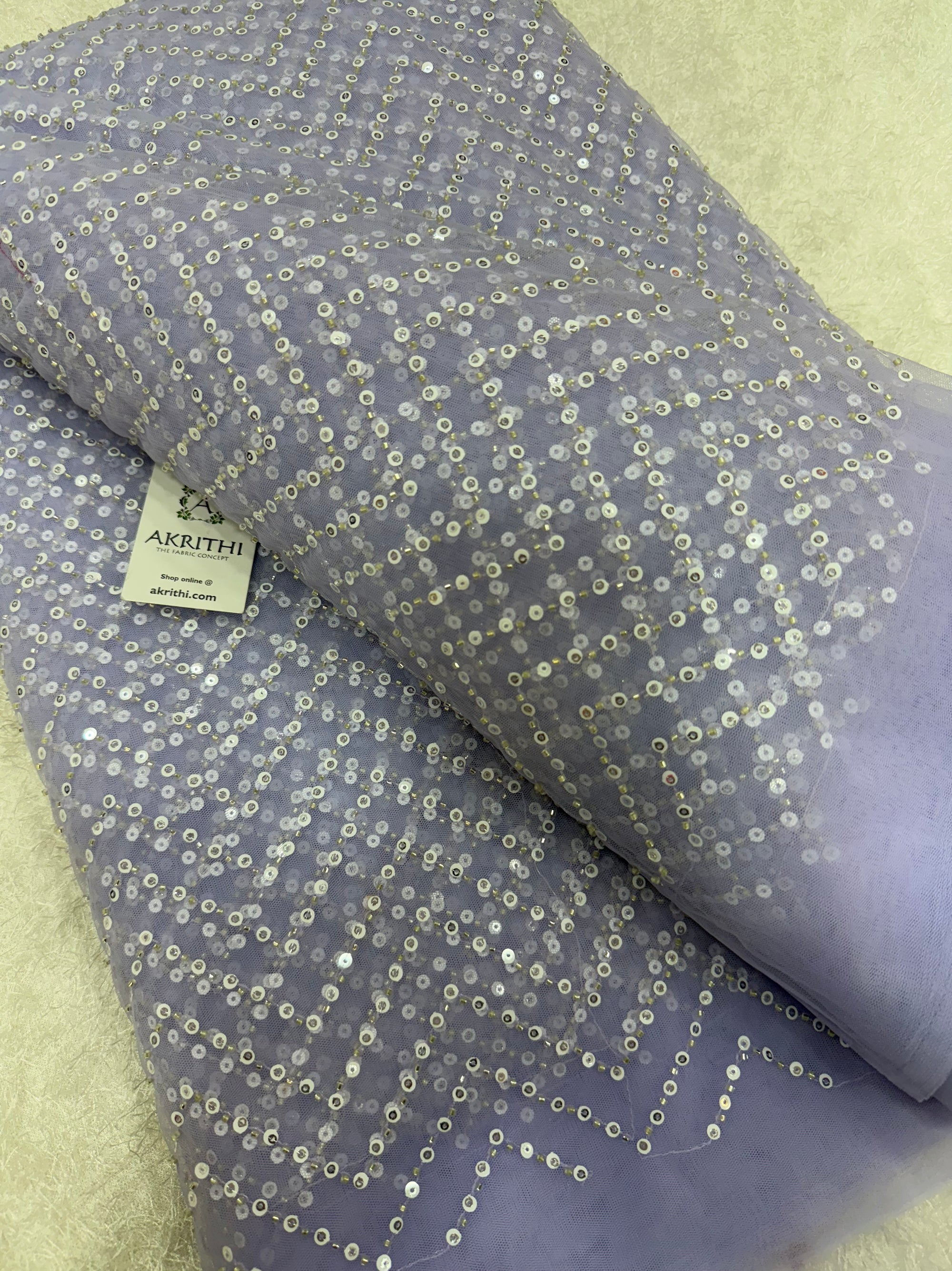 Embroidered net fabric