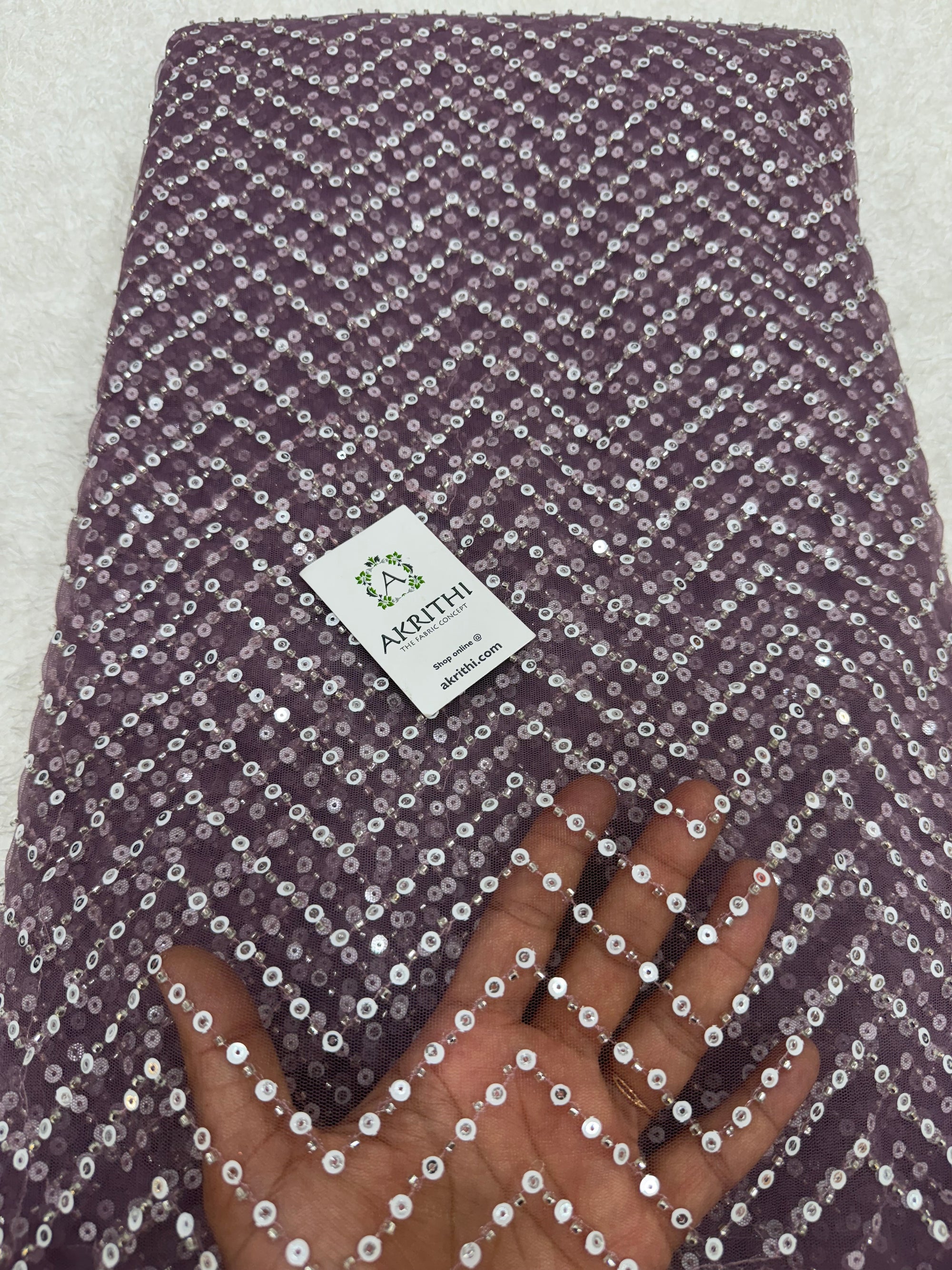 Embroidered net fabric
